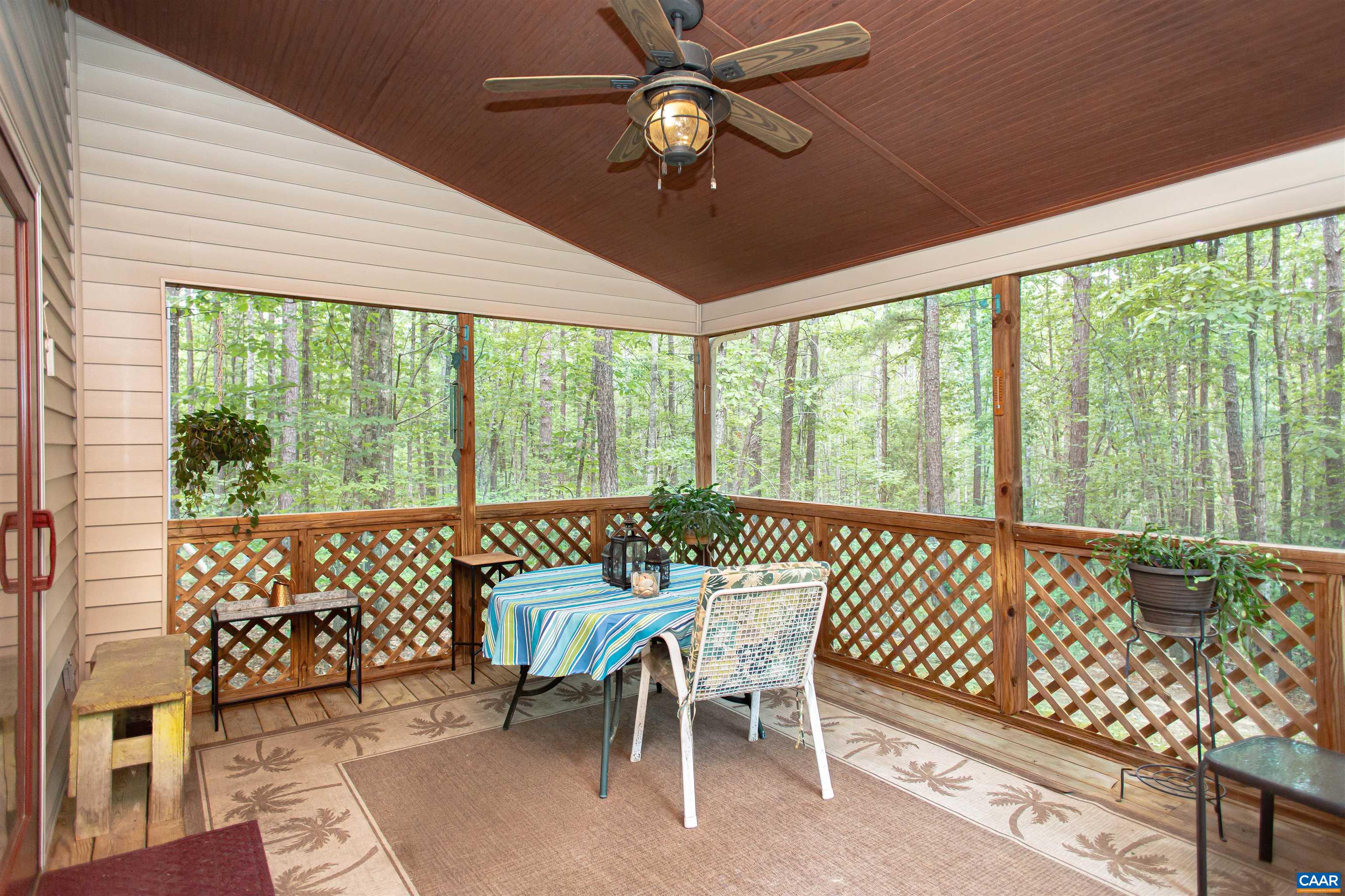 Cozy screened porch perfect for outdoor dining & relaxing. Cozy screened porch perfect for outdoor dining & relaxing.