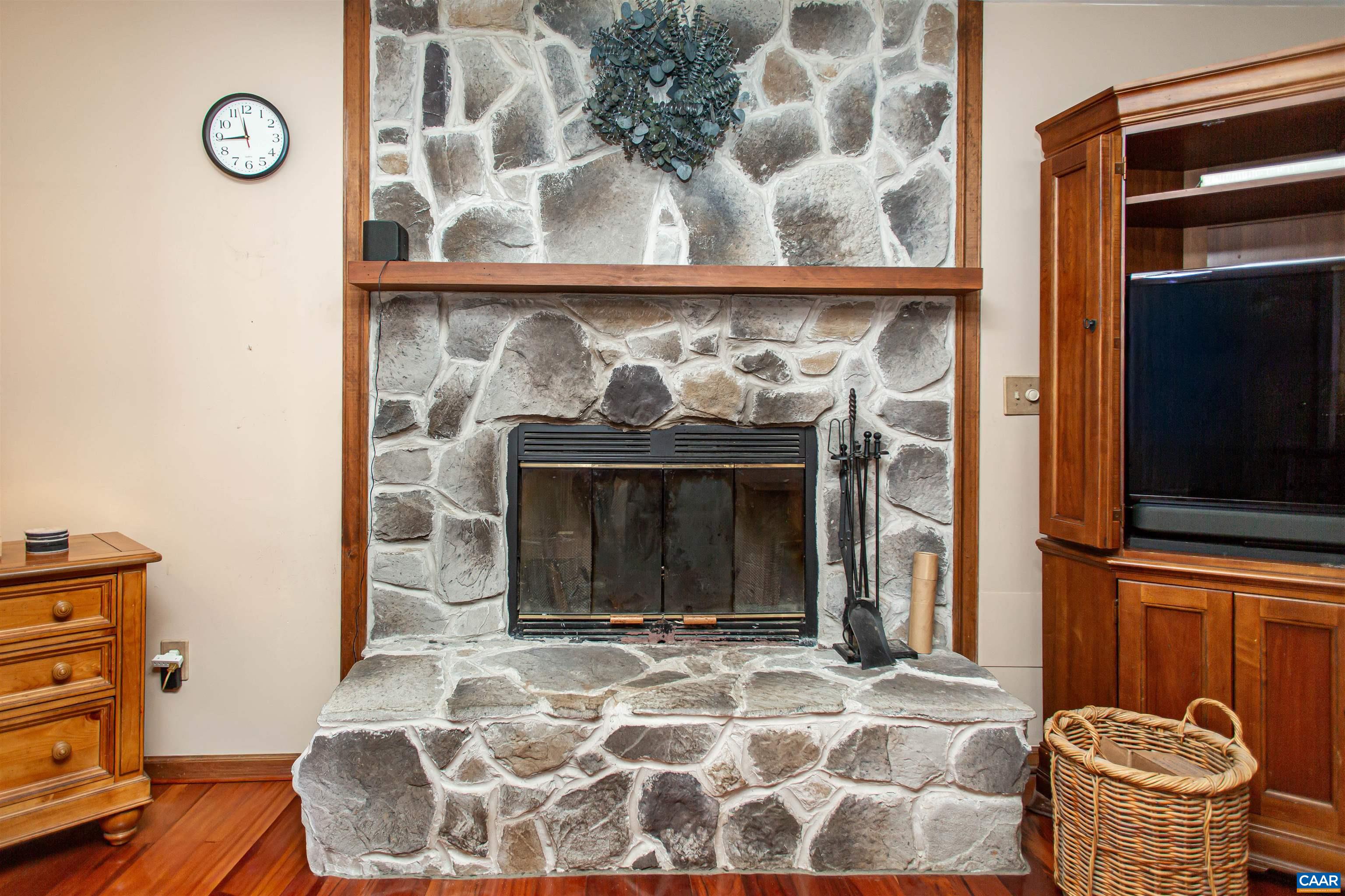 With a woodburning stone fireplace. With a woodburning stone fireplace.