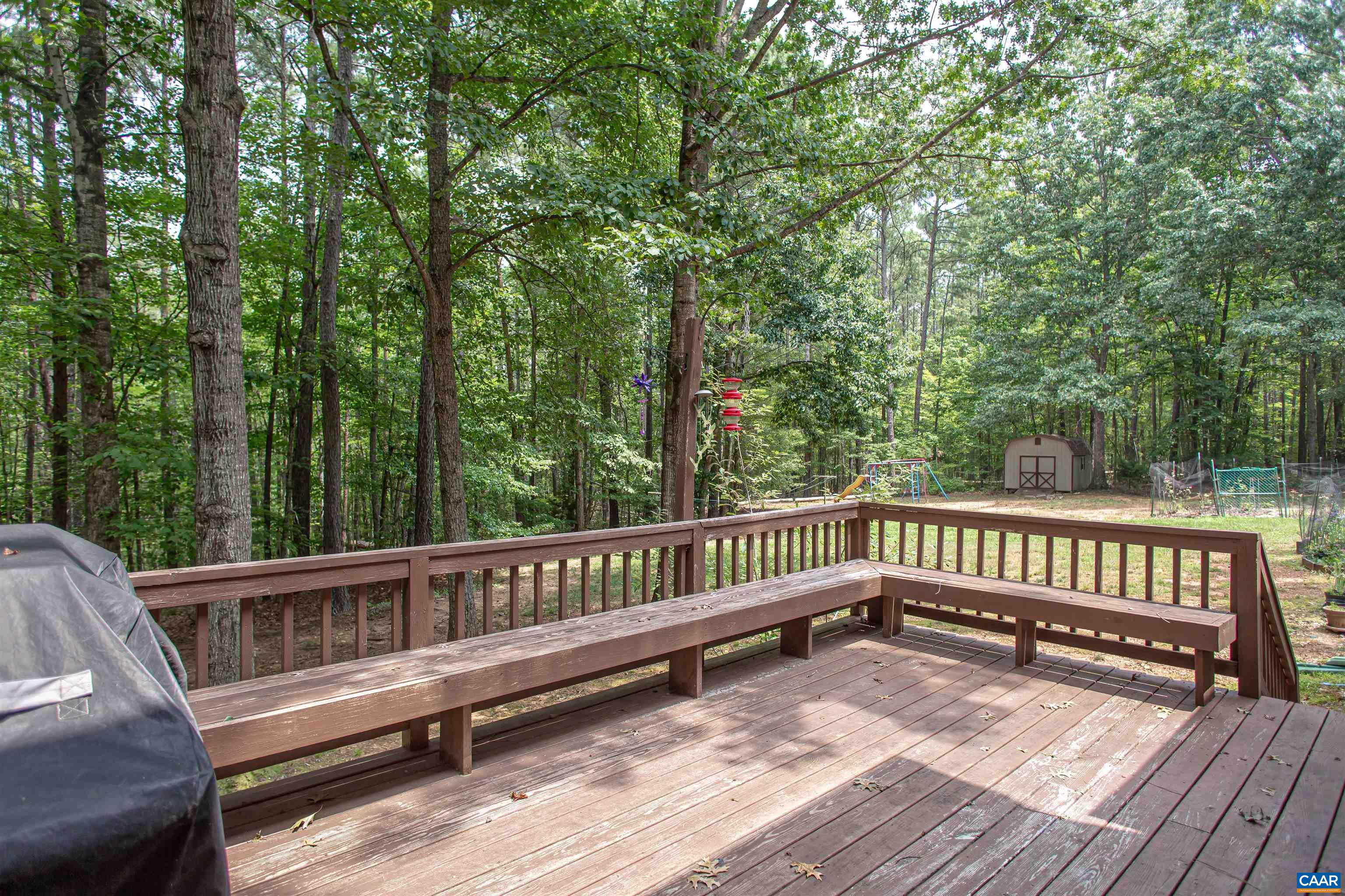 Cozy deck off the screened patio with built-in seating. Cozy deck off the screened patio with built-in seating.
