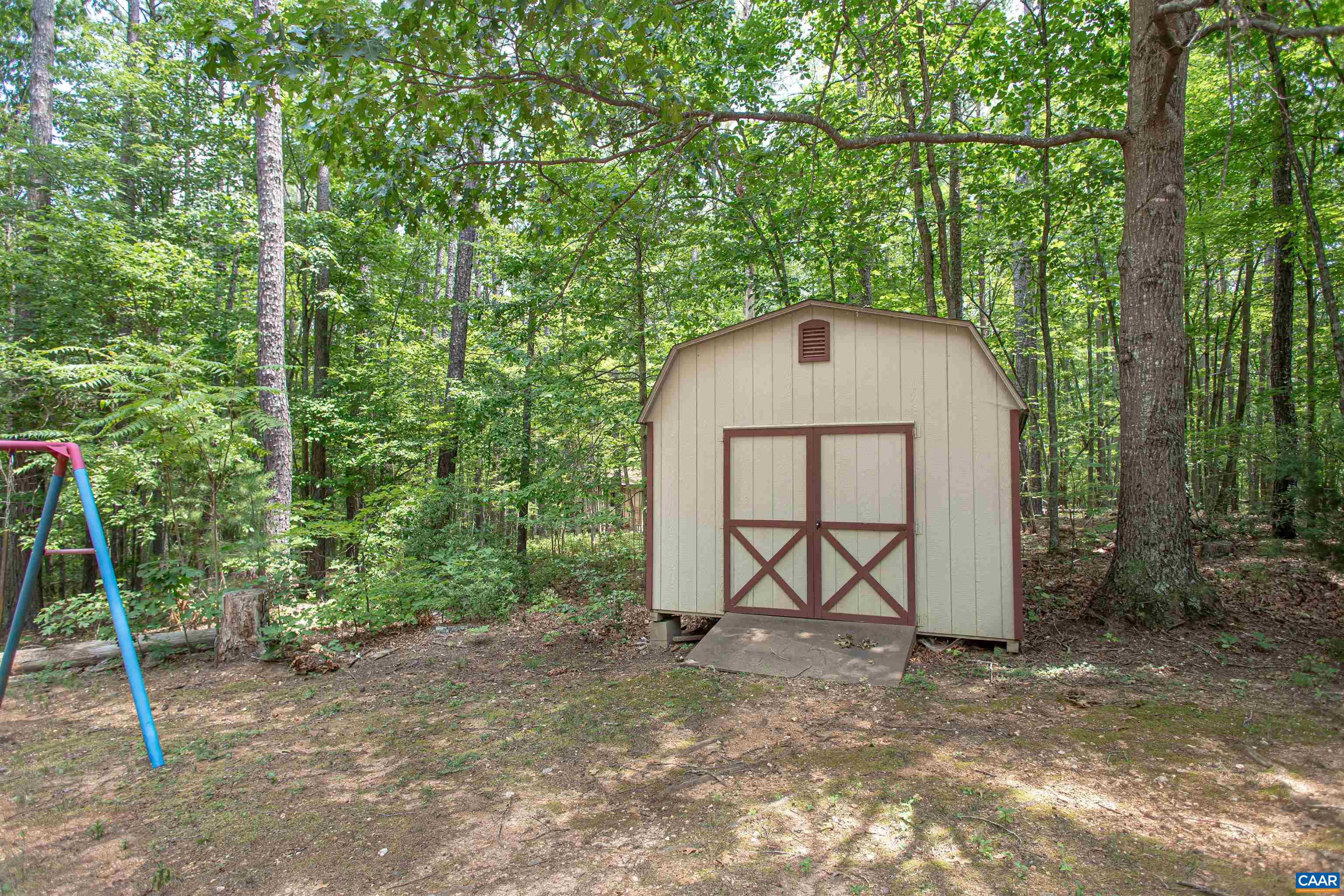 Shed & playground in yard. Shed & playground in yard.