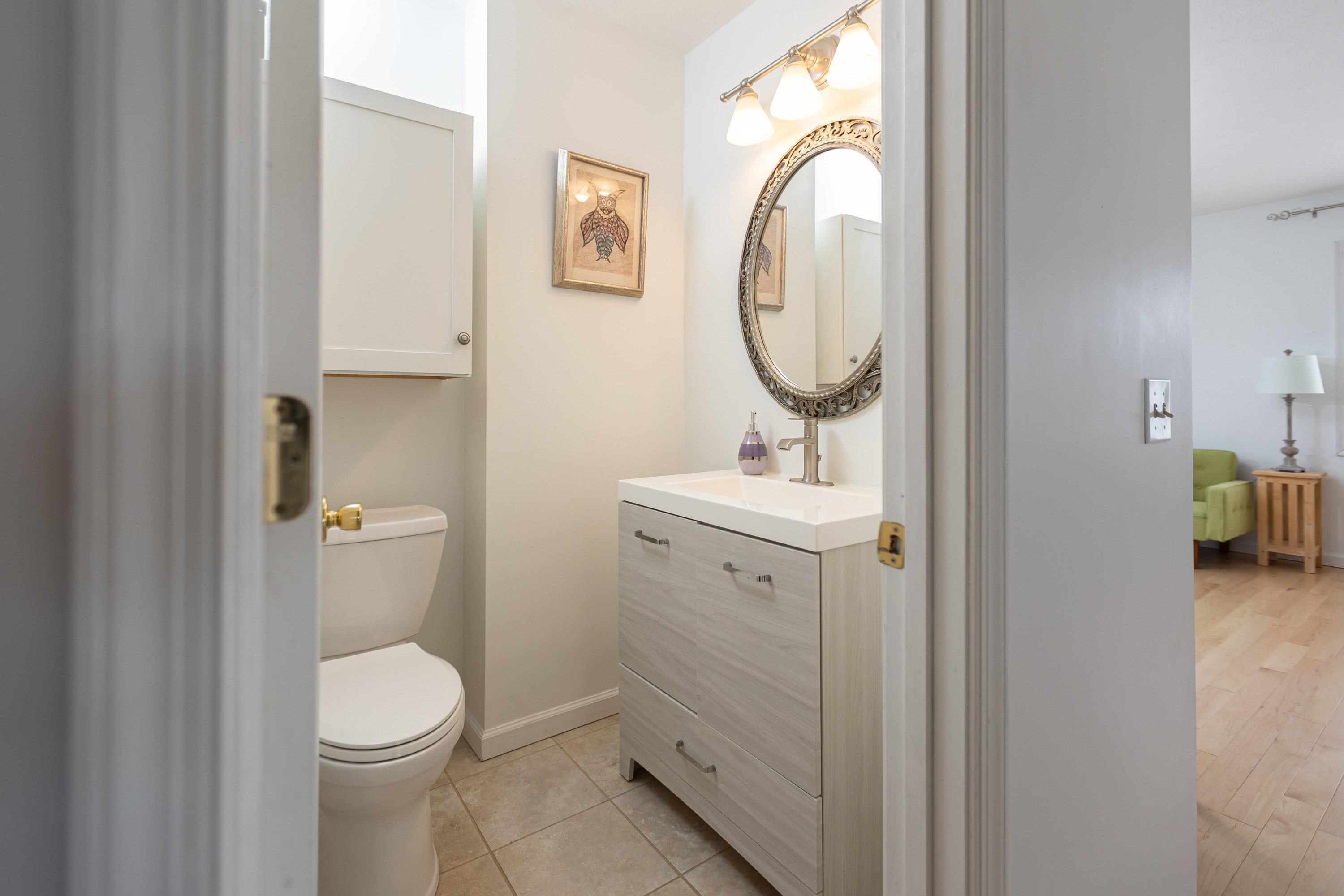 The powder bath features storage with cabinetry and is convenient to the living areas of the home. The powder bath features storage with cabinetry and is convenient to the living areas of the home.