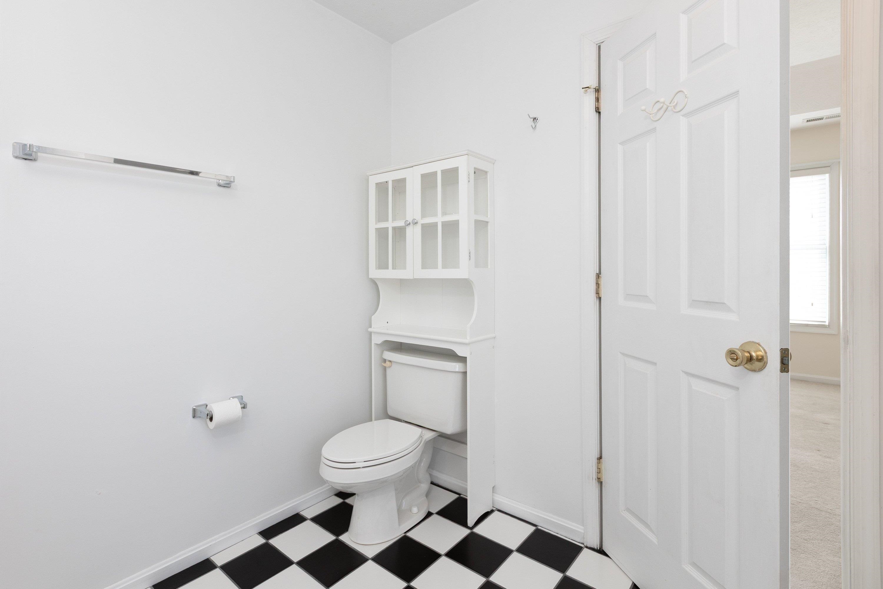 This full bathroom offers dual vanities and a vanity with storage. This space features tile flooring and a bathtub with walk-in shower space. This full bathroom offers dual vanities and a vanity with storage. This space features tile flooring and a bathtub with walk-in shower space.