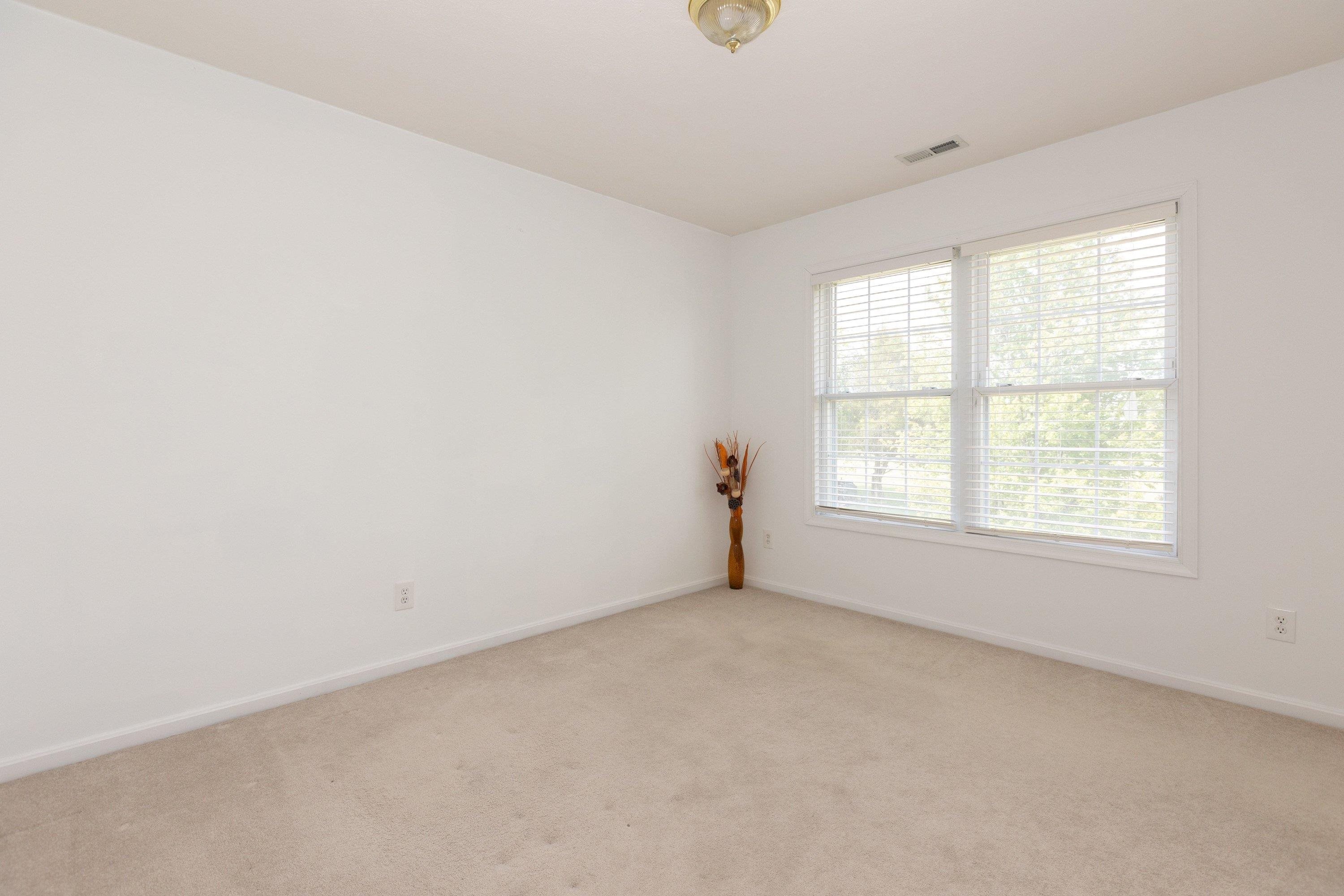 This second bedroom, on the upper level of the home, features comfortable flooring throughout, large windows, and large closet space. This second bedroom, on the upper level of the home, features comfortable flooring throughout, large windows, and large closet space.