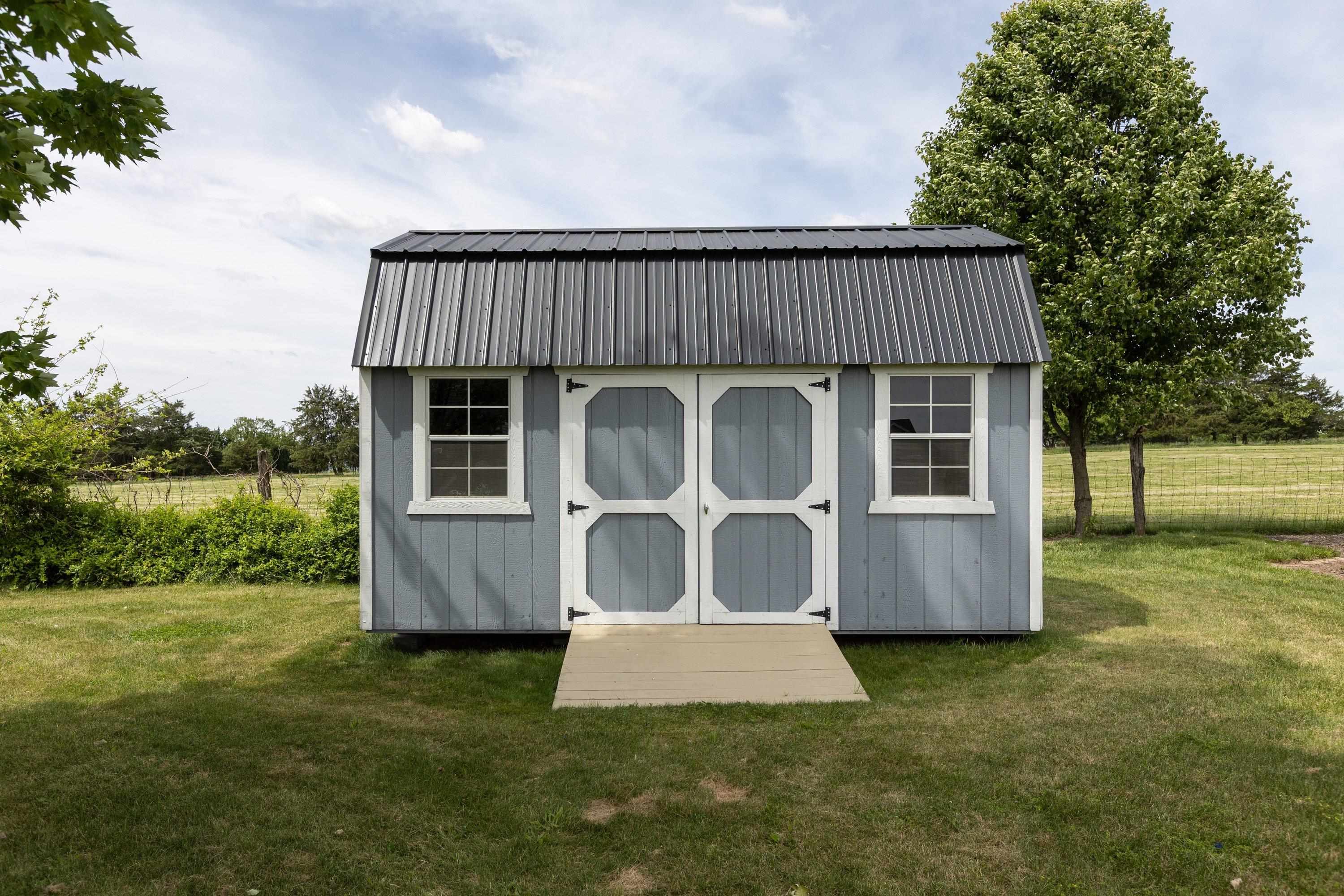 The storage building offers lots of storage opportunity in the backyard of the home. The storage building offers lots of storage opportunity in the backyard of the home.