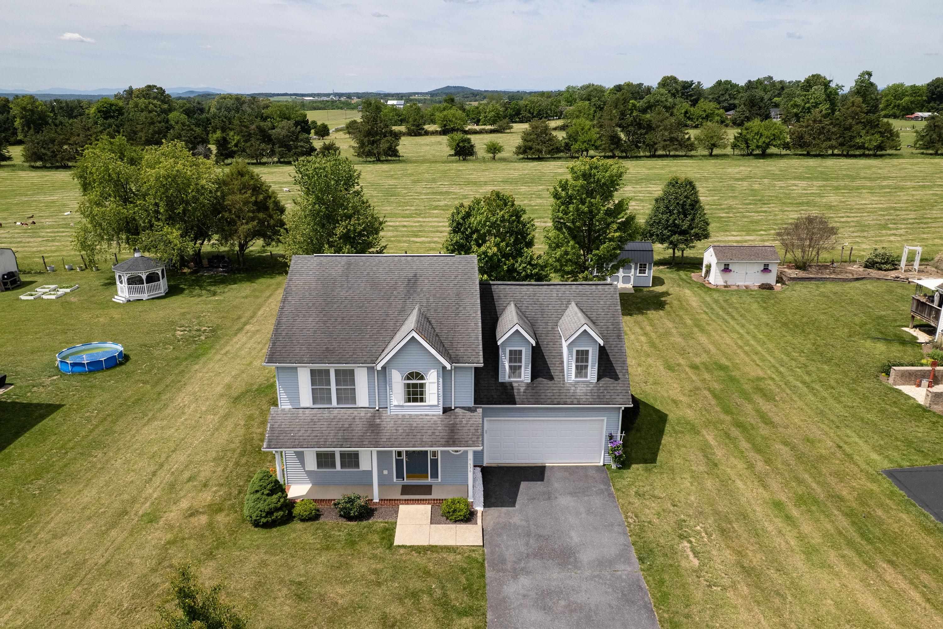 The aerial views highlight the large yard of the home, location within the Three Leagues subdivision, and much more! The aerial views highlight the large yard of the home, location within the Three Leagues subdivision, and much more!