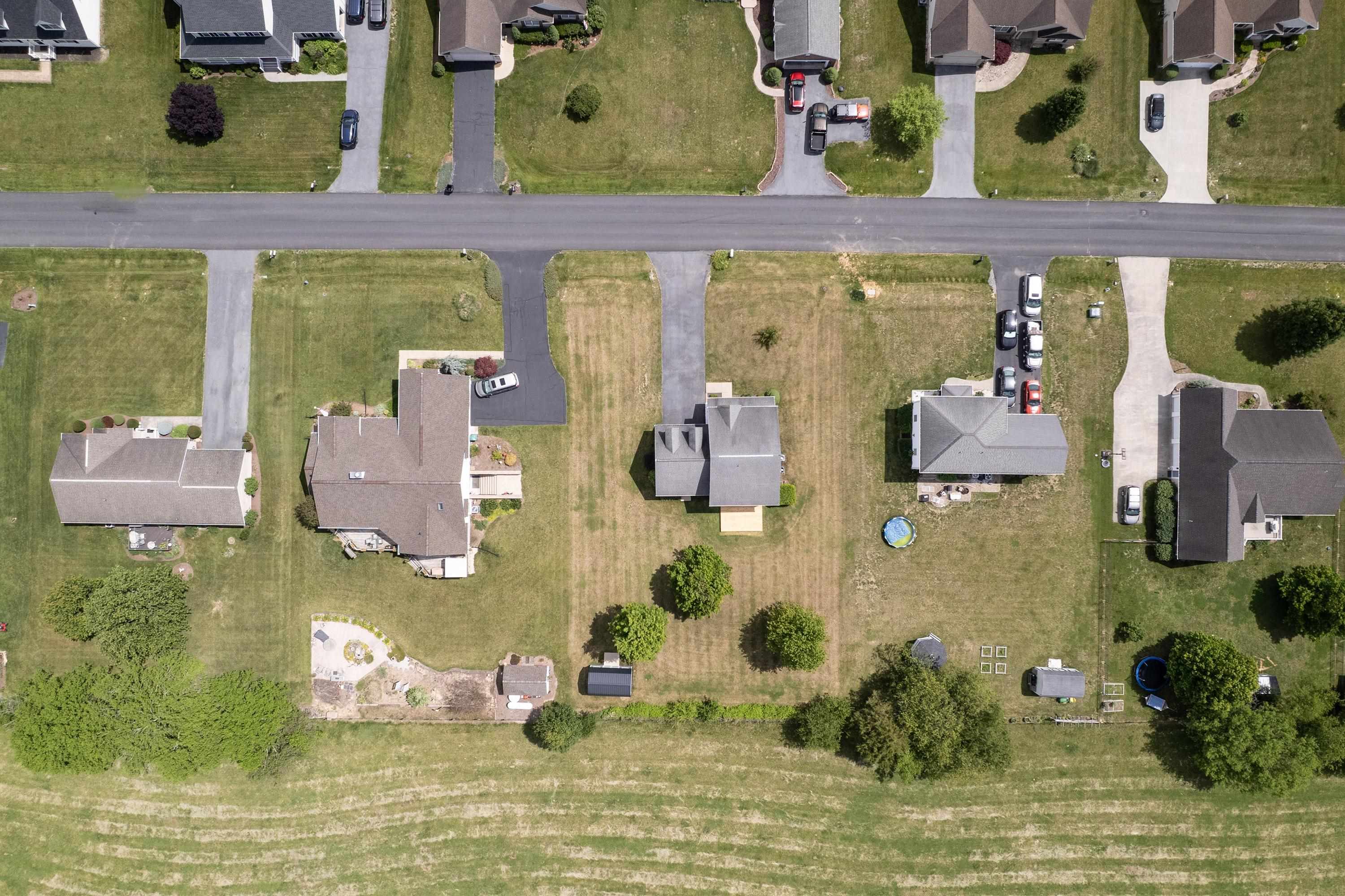 The aerial views highlight the large yard of the home, location within the Three Leagues subdivision, and much more! The aerial views highlight the large yard of the home, location within the Three Leagues subdivision, and much more!