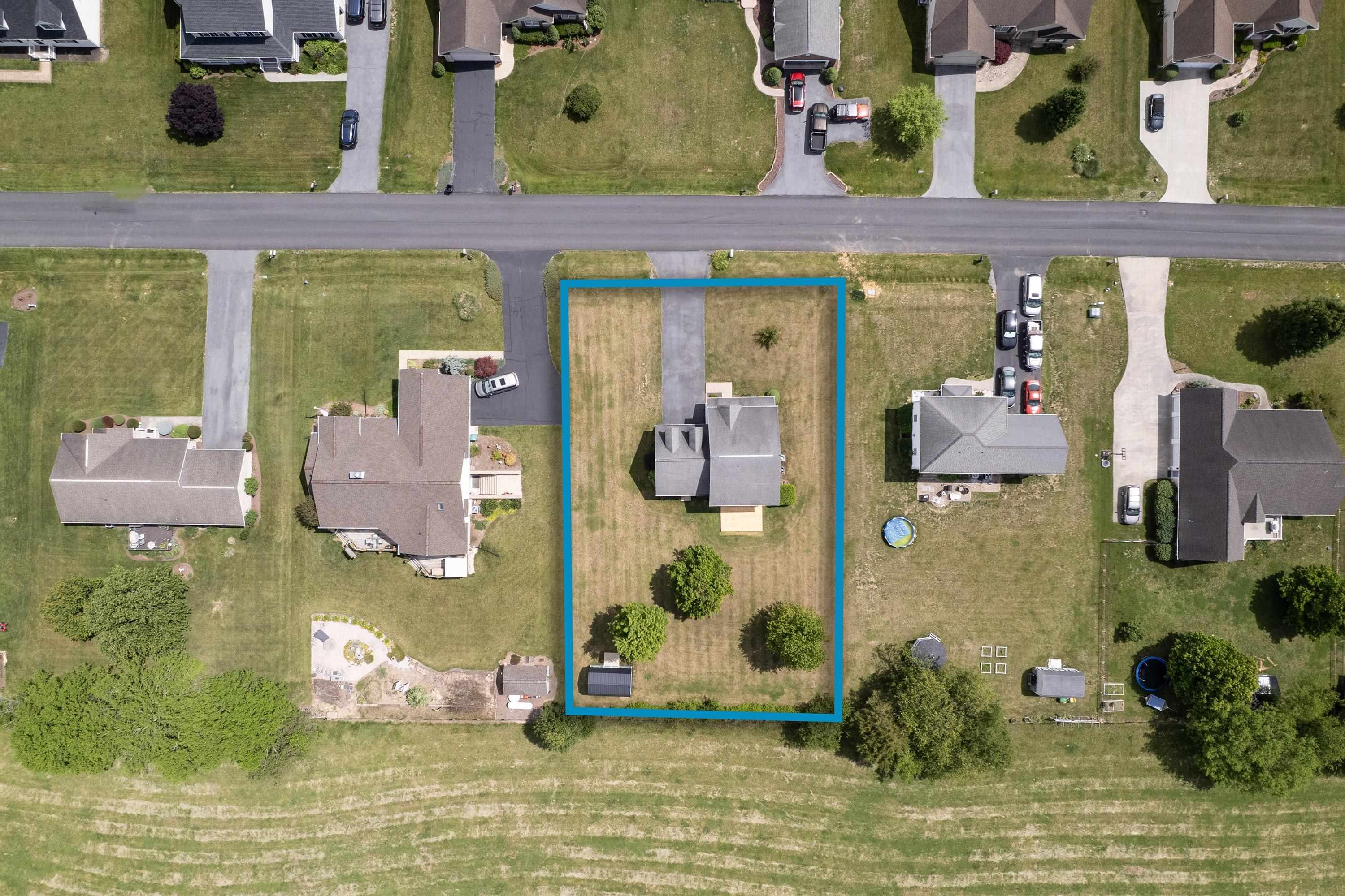 The aerial views highlight the large yard of the home, location within the Three Leagues subdivision, and much more! The aerial views highlight the large yard of the home, location within the Three Leagues subdivision, and much more!