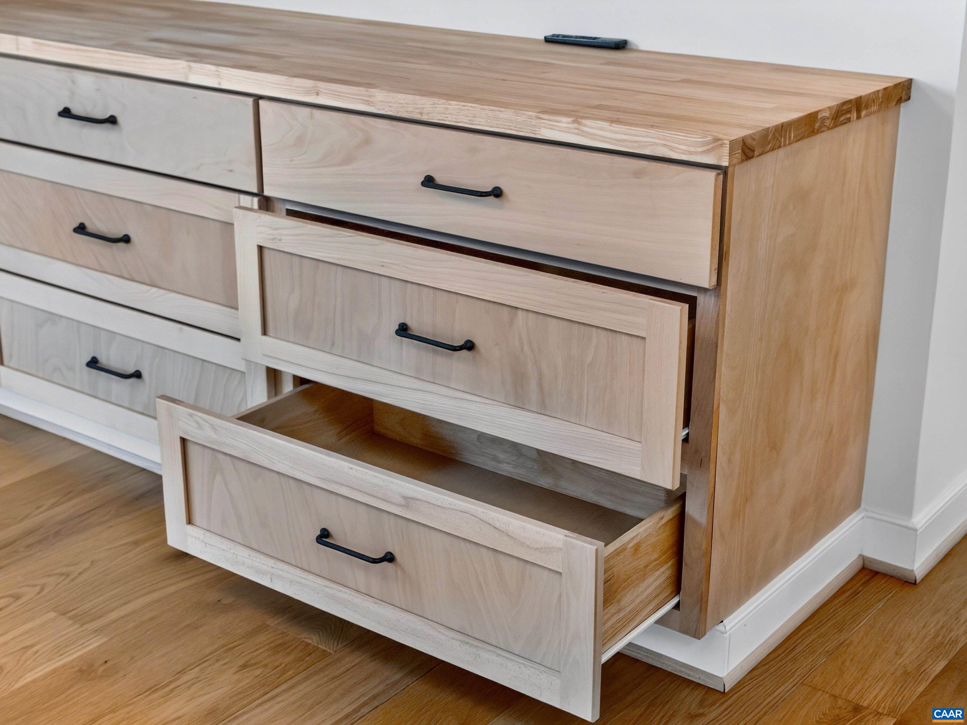 Custom built-in cabinetry with butcher block countertop. Custom built-in cabinetry with butcher block countertop.