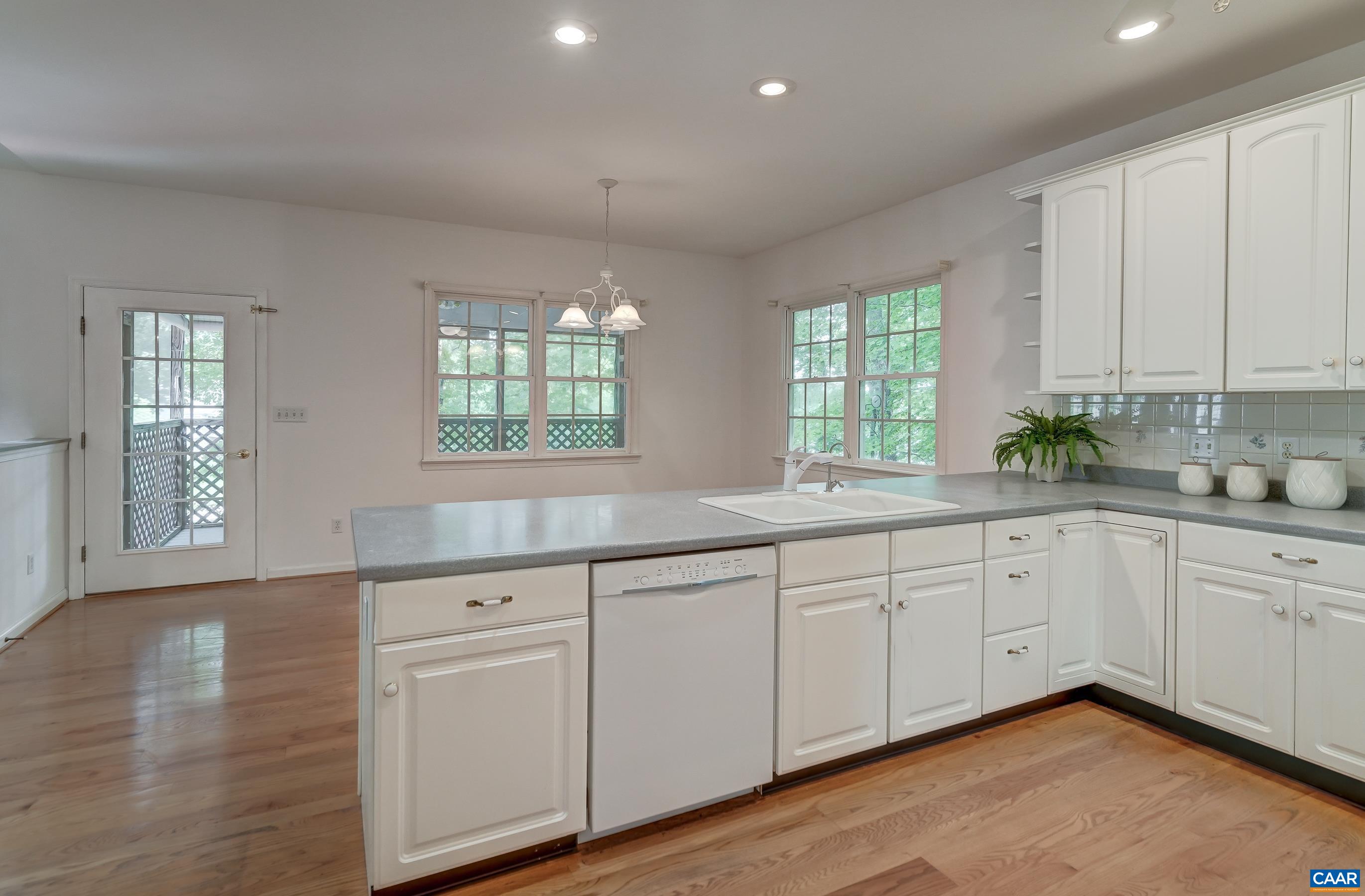 Large breakfast bar opens to sunny breakfast area. Large breakfast bar opens to sunny breakfast area.