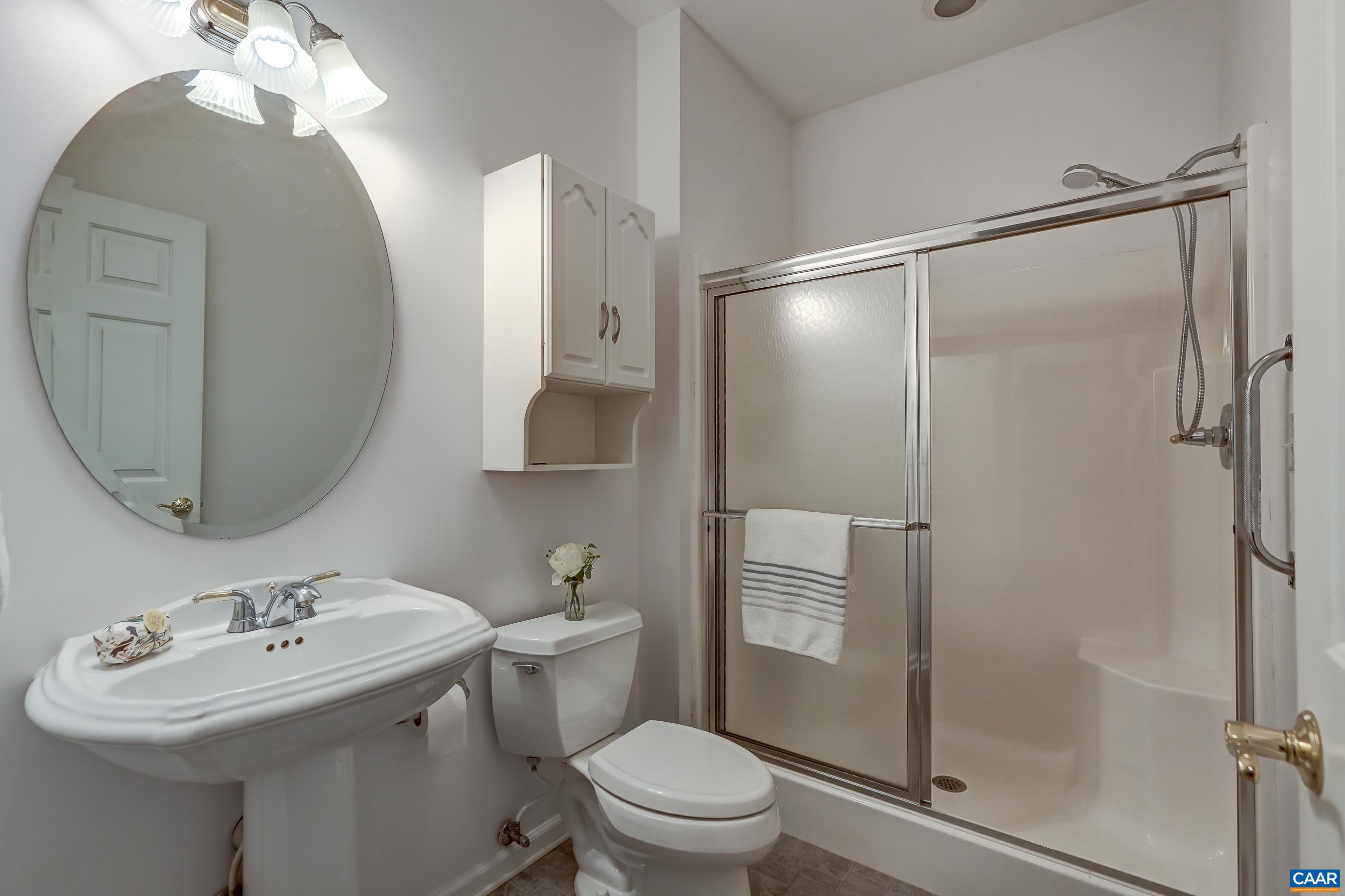 Full guest bathroom with shower. Full guest bathroom with shower.