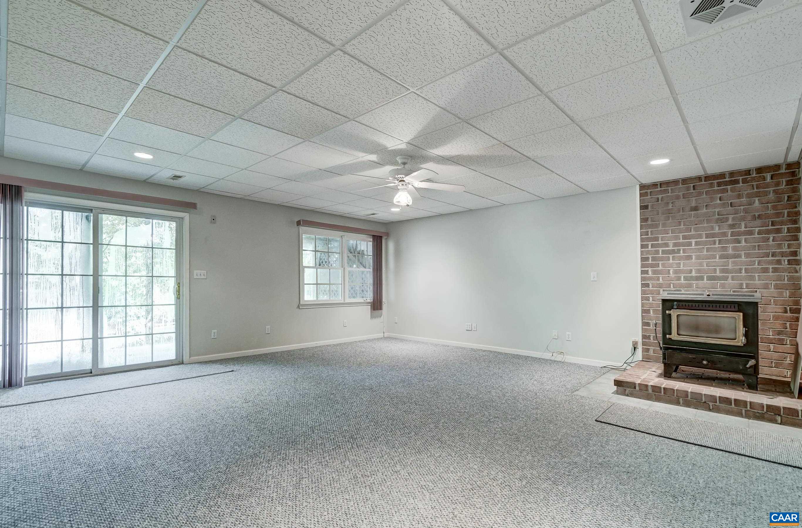 Lower level features a large rec room with coal-stove for auxillary heat! Lower level features a large rec room with coal-stove for auxillary heat!