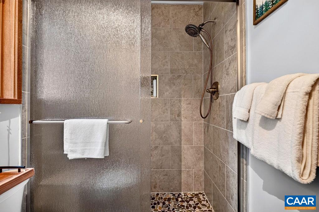 The tiled shower in the primary bathroom is brand new. The tiled shower in the primary bathroom is brand new.