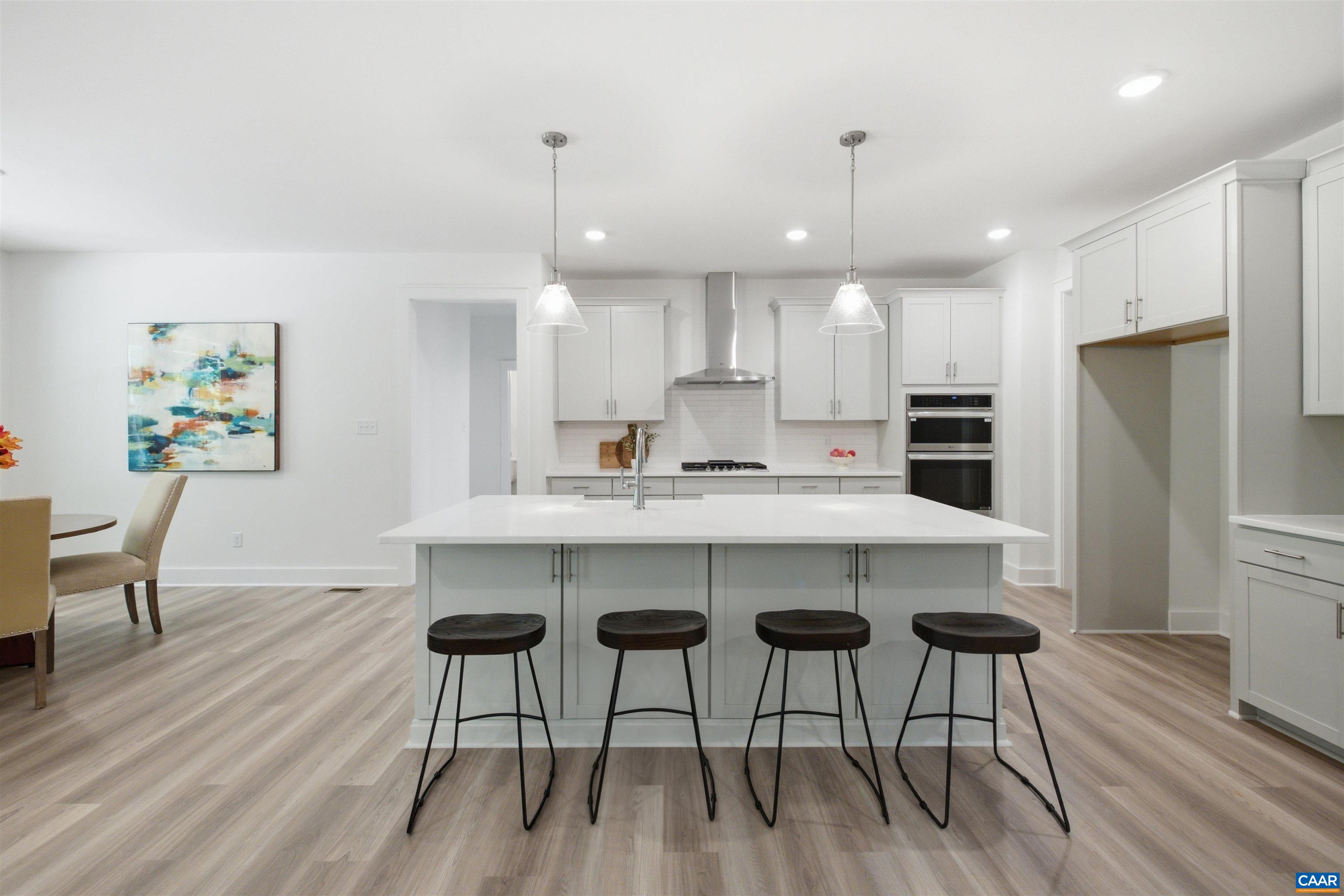 View to gourmet kitchen. Staged home. View to gourmet kitchen. Staged home.