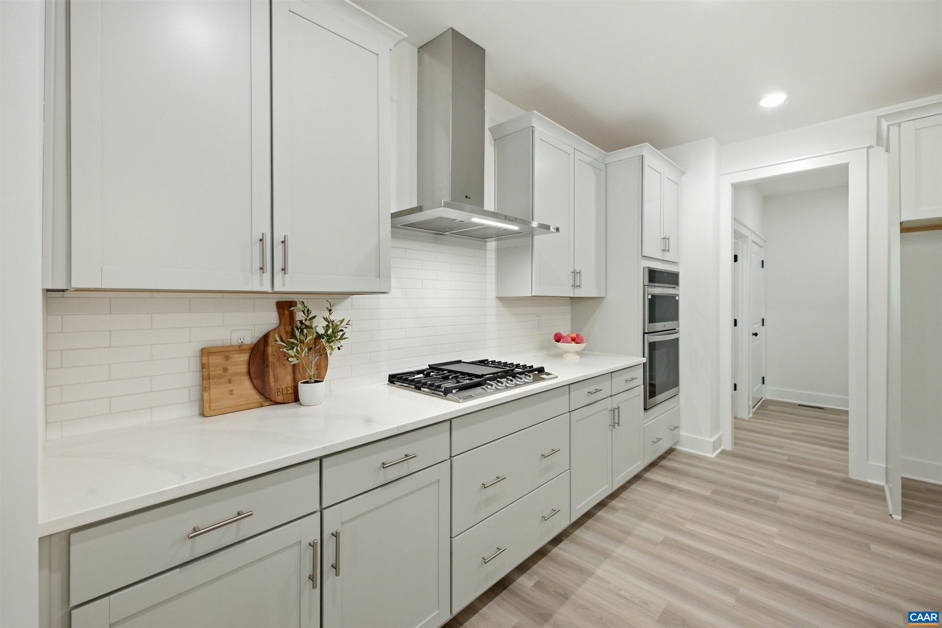 To pantry, mudroom and garage. Staged home. To pantry, mudroom and garage. Staged home.