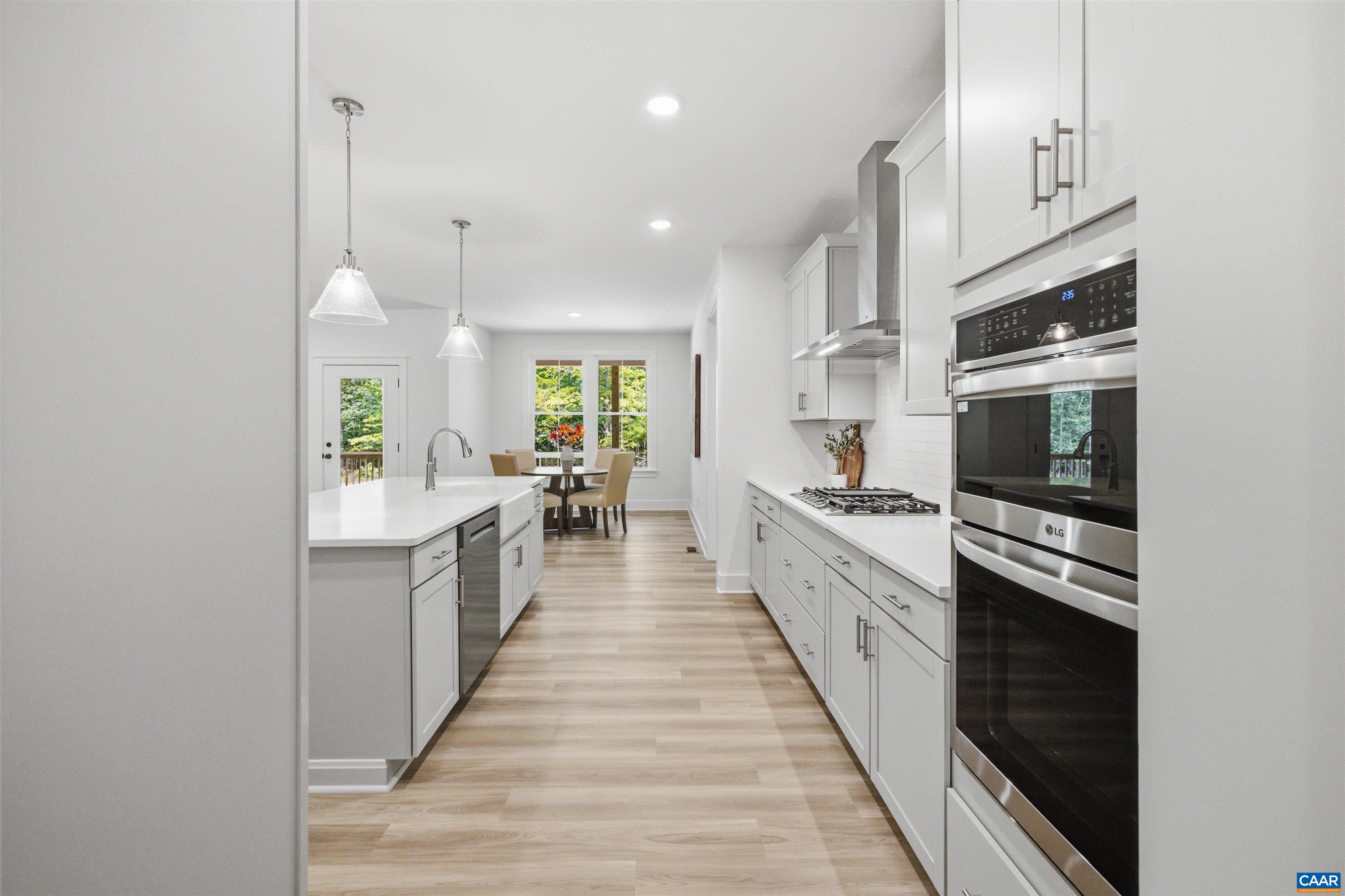 View from Pantry/Mudroom to Kitchen/Dinette. Staged home. View from Pantry/Mudroom to Kitchen/Dinette. Staged home.