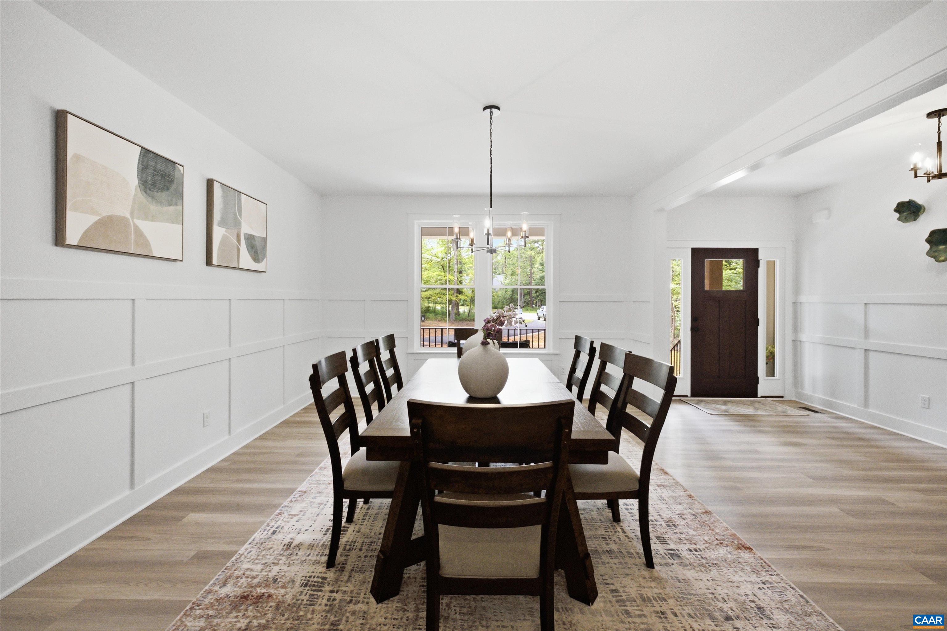 View from kitchen area to foyer. Staged home. View from kitchen area to foyer. Staged home.