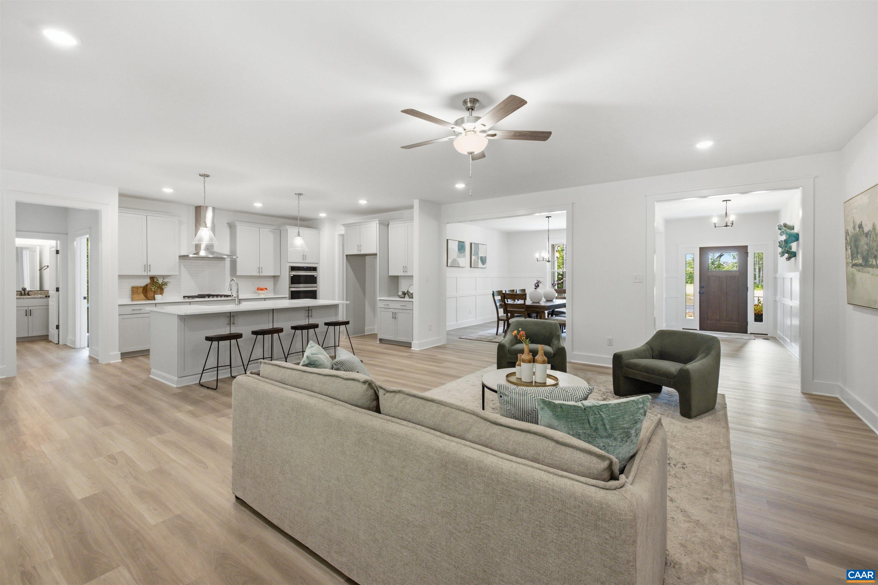 Views to the kitchen, foyer and dining room. Staged home. Views to the kitchen, foyer and dining room. Staged home.