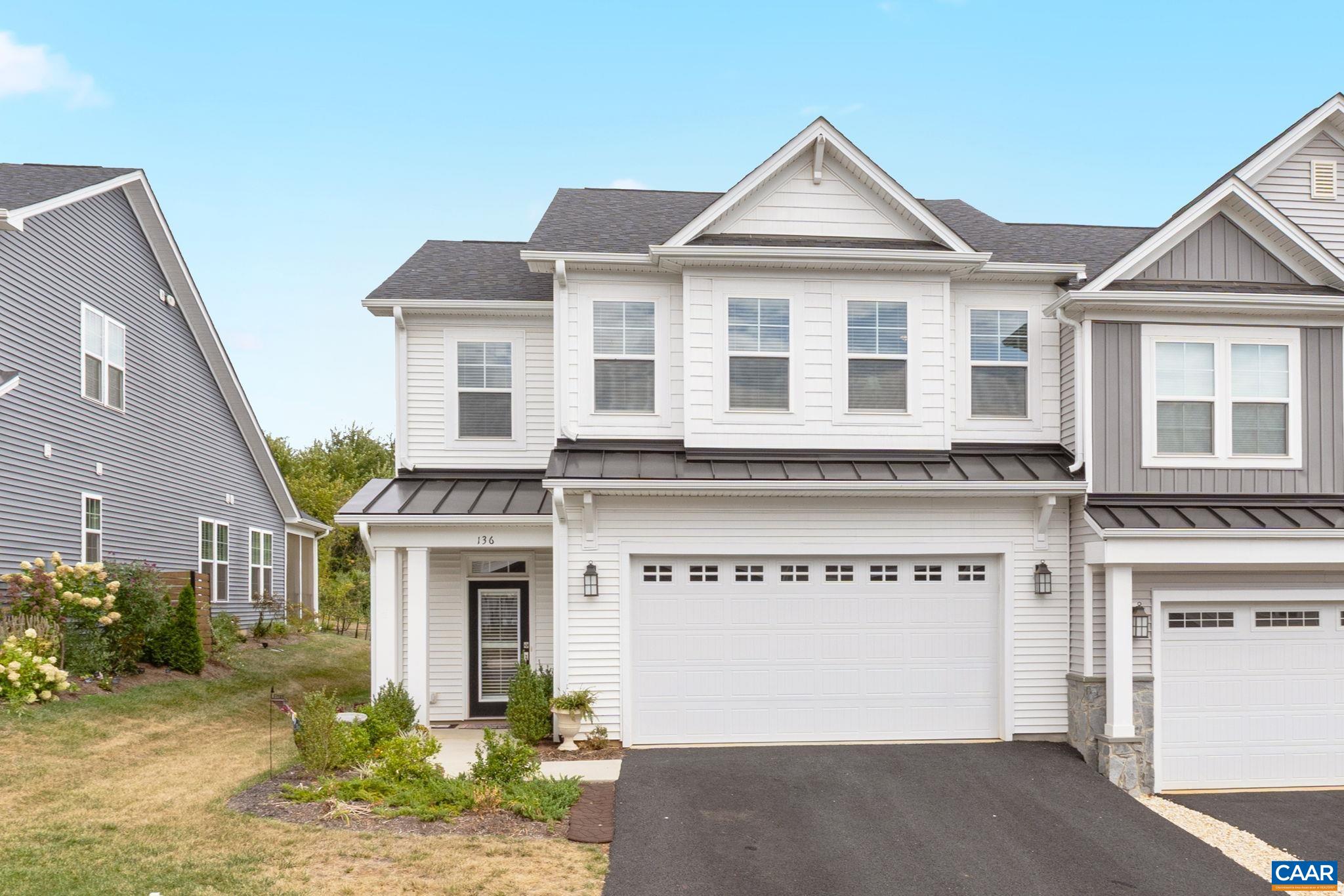 Front of home with paved drive.