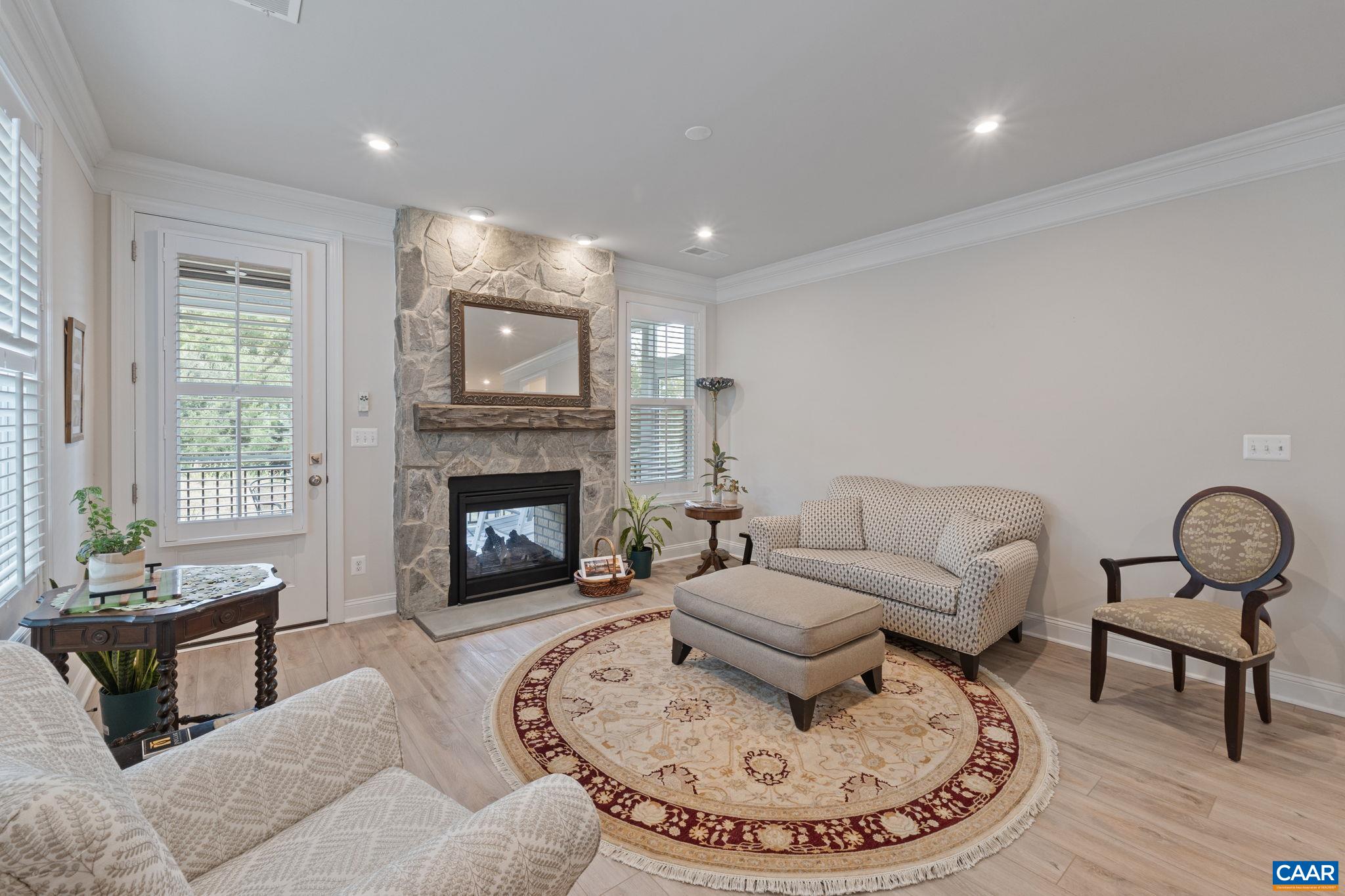 Family room with door to screen porch and patio.