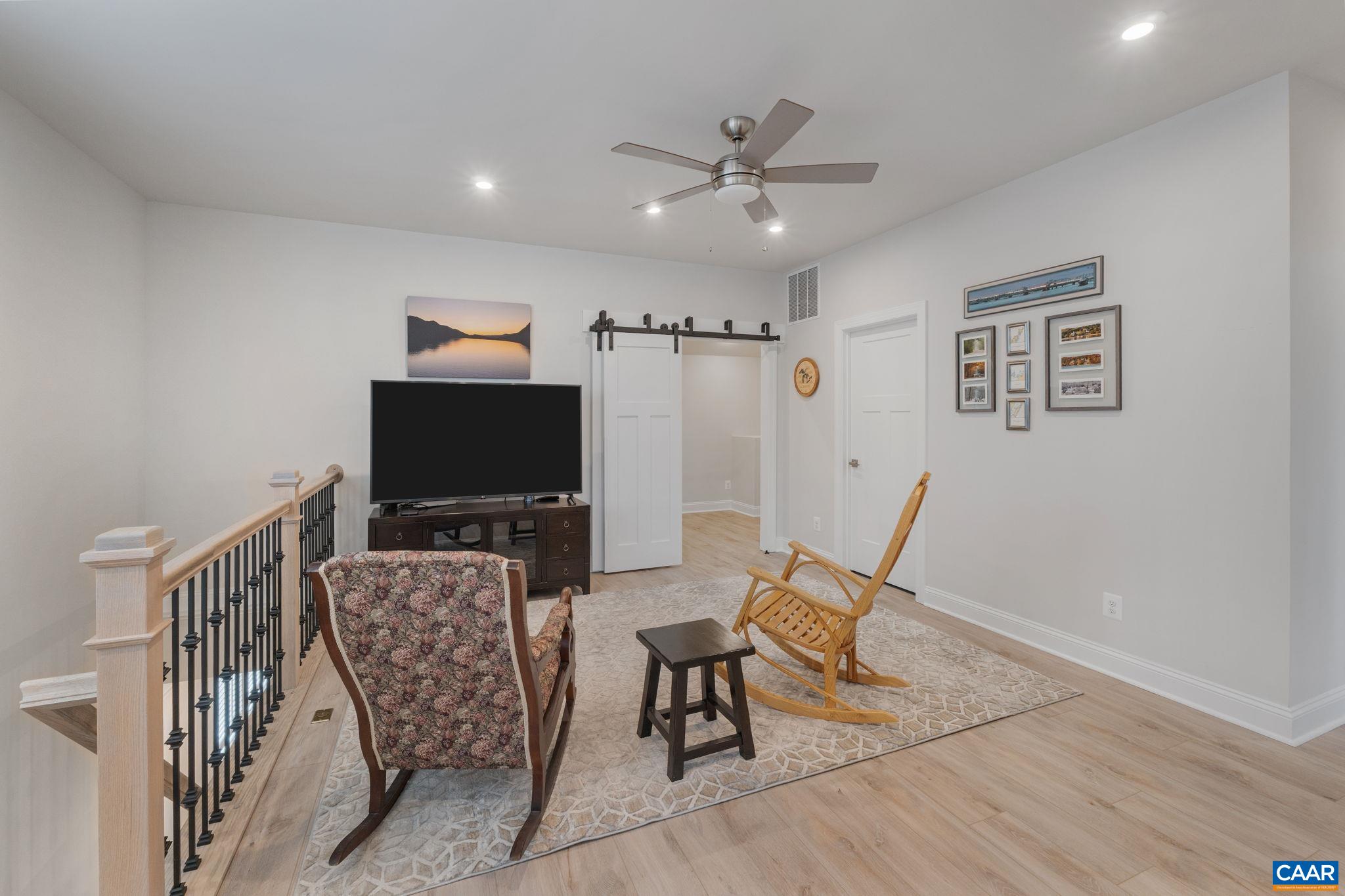 Upstairs loft with finished bonus room with double barn doors.