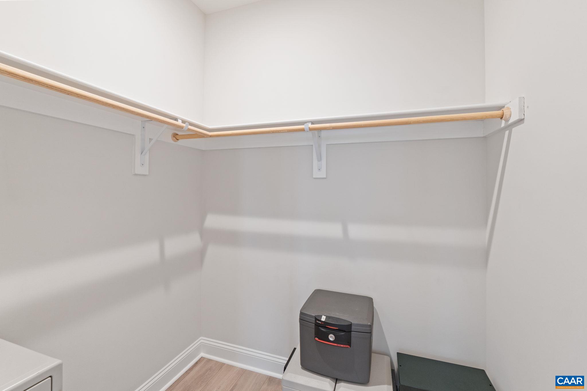 Closets with wood shelving.