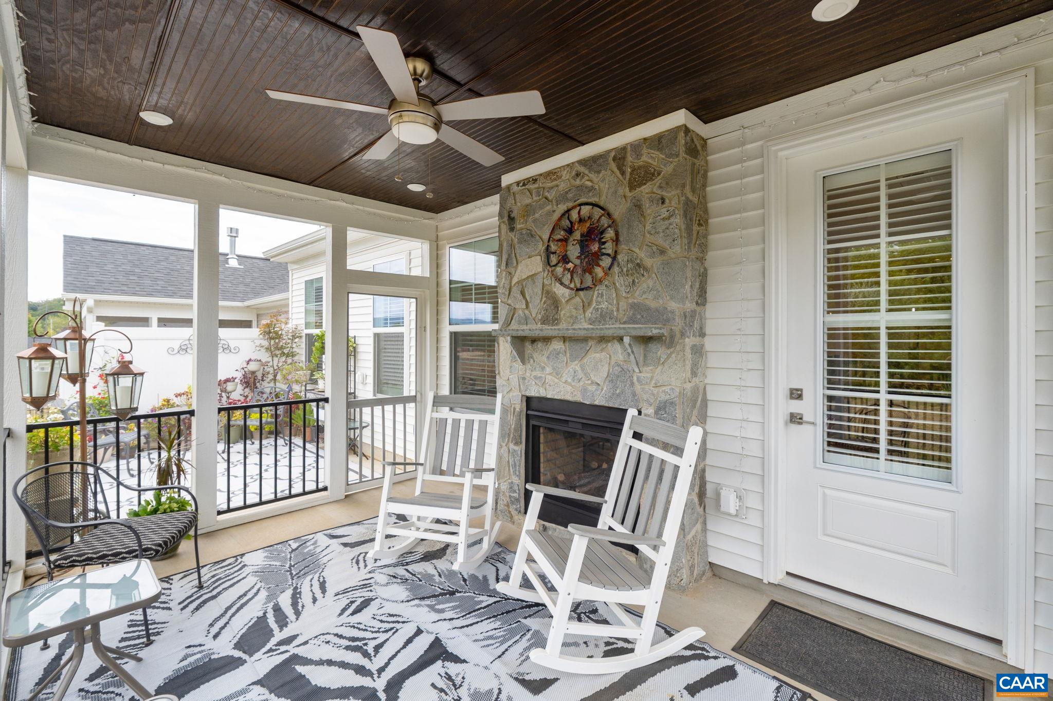 Screen porch with see-through fireplace.
