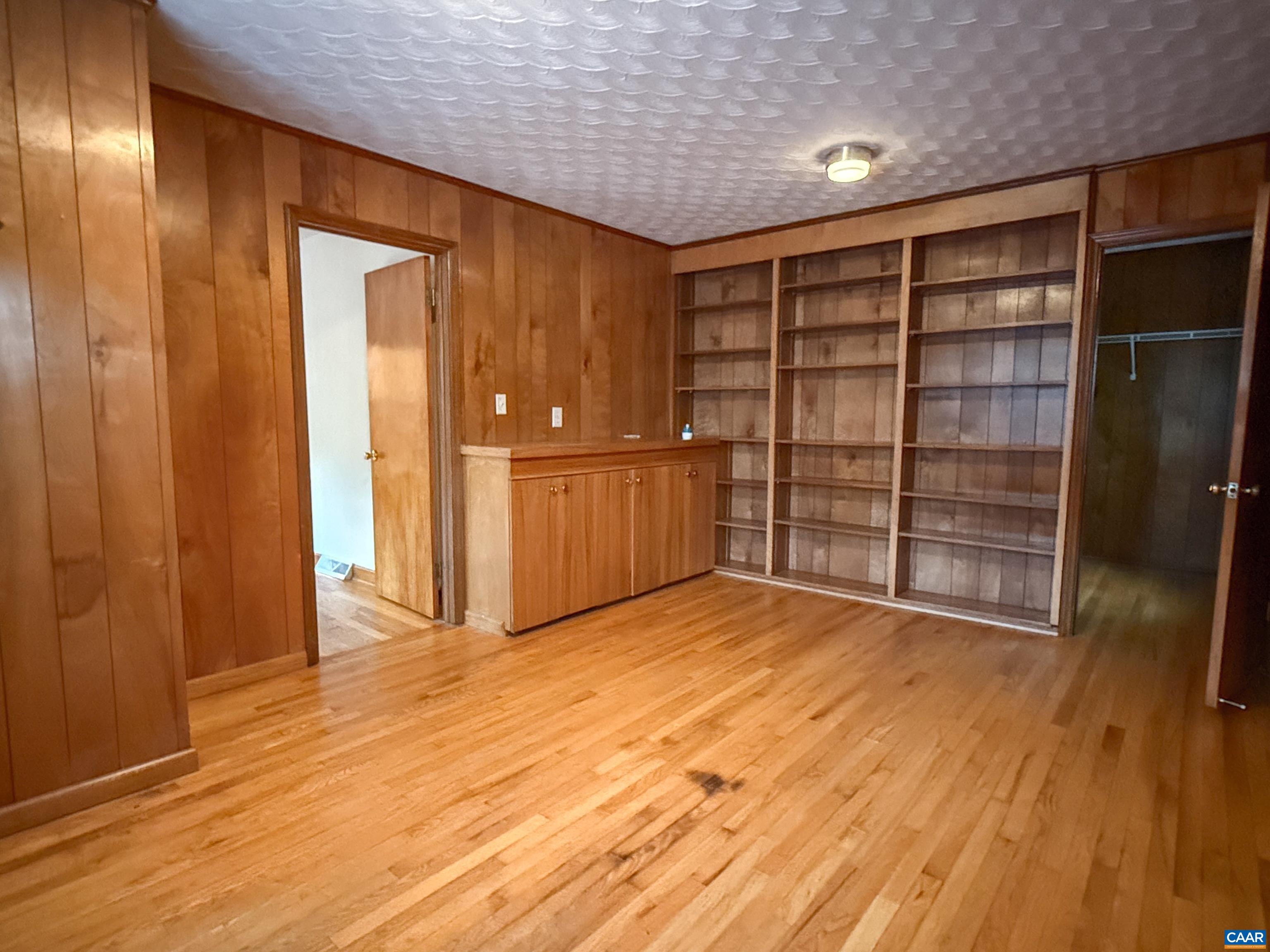This could be used as a bedroom with a walk in closet or an office with plenty of storage.