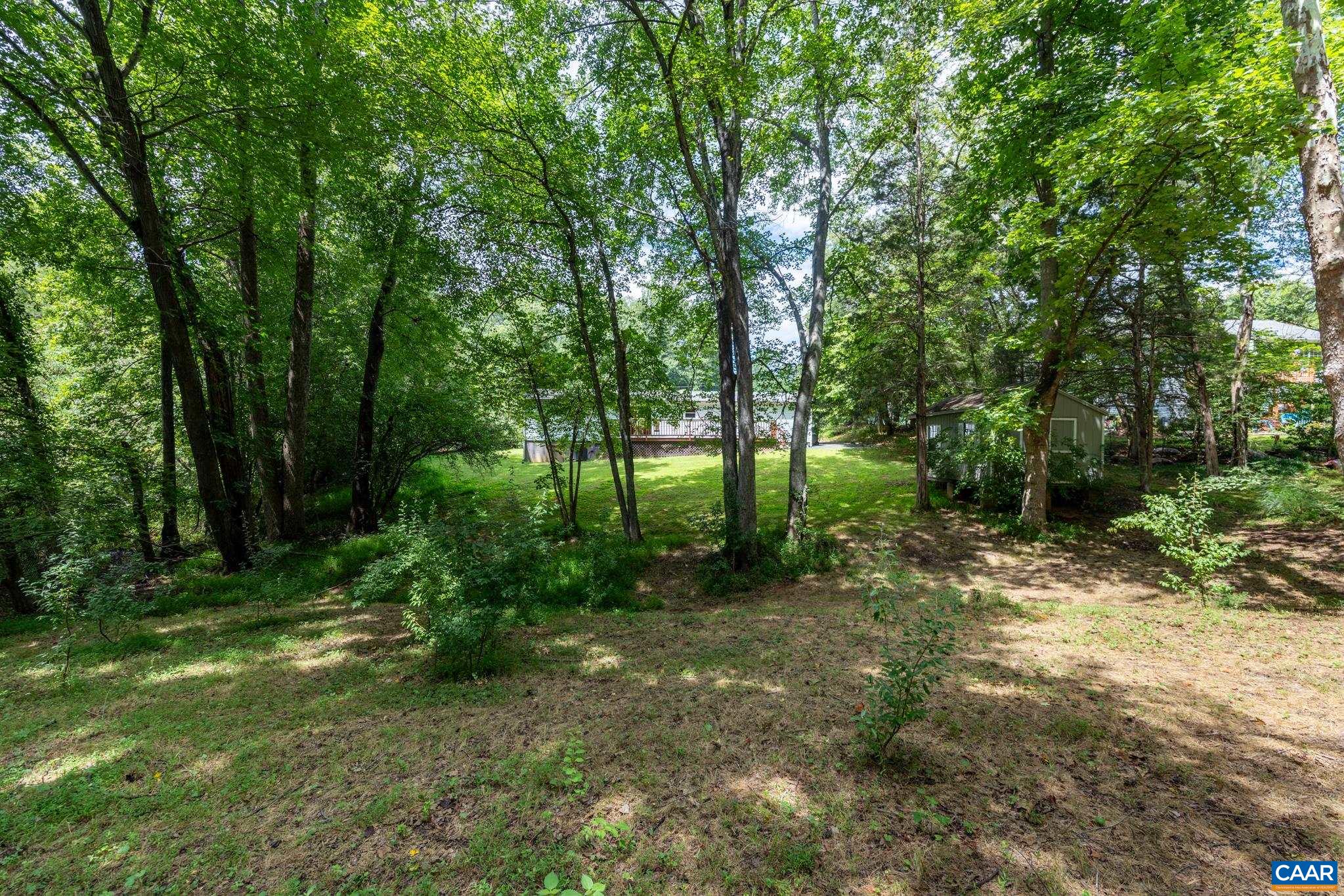 Serene, wooded lot offering unmatched privacy and natural beauty! Framed by mature shade trees and lush greenery, this tranquil outdoor space is ideal for nature lovers, peaceful relaxation, and endless outdoor potential.