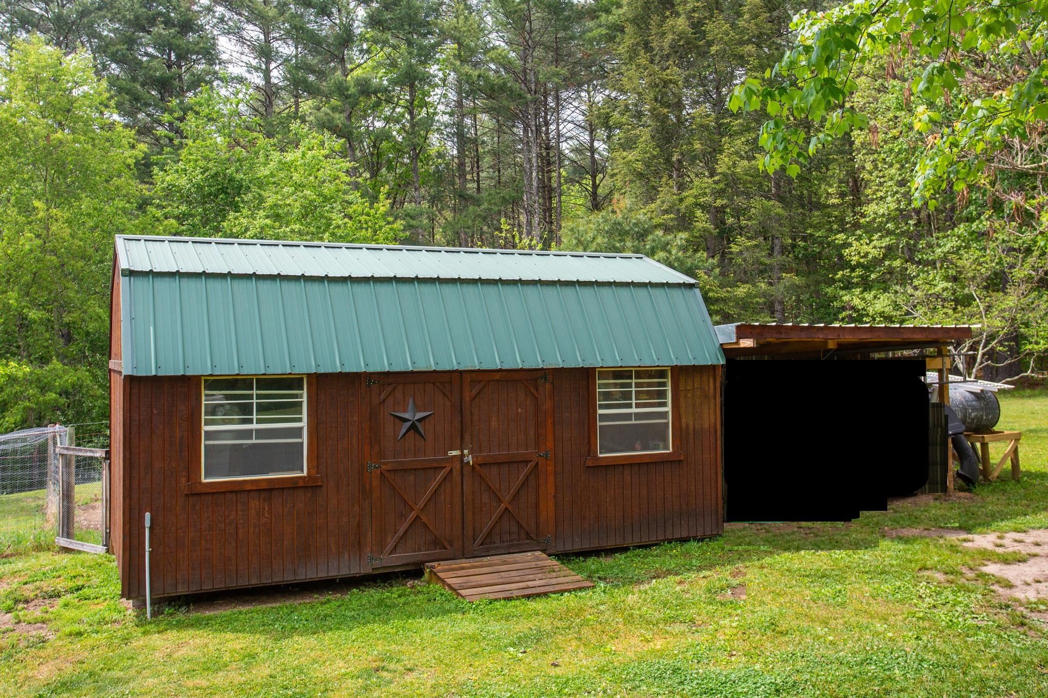 with lean-to for equipment. Make a great guest quarters.