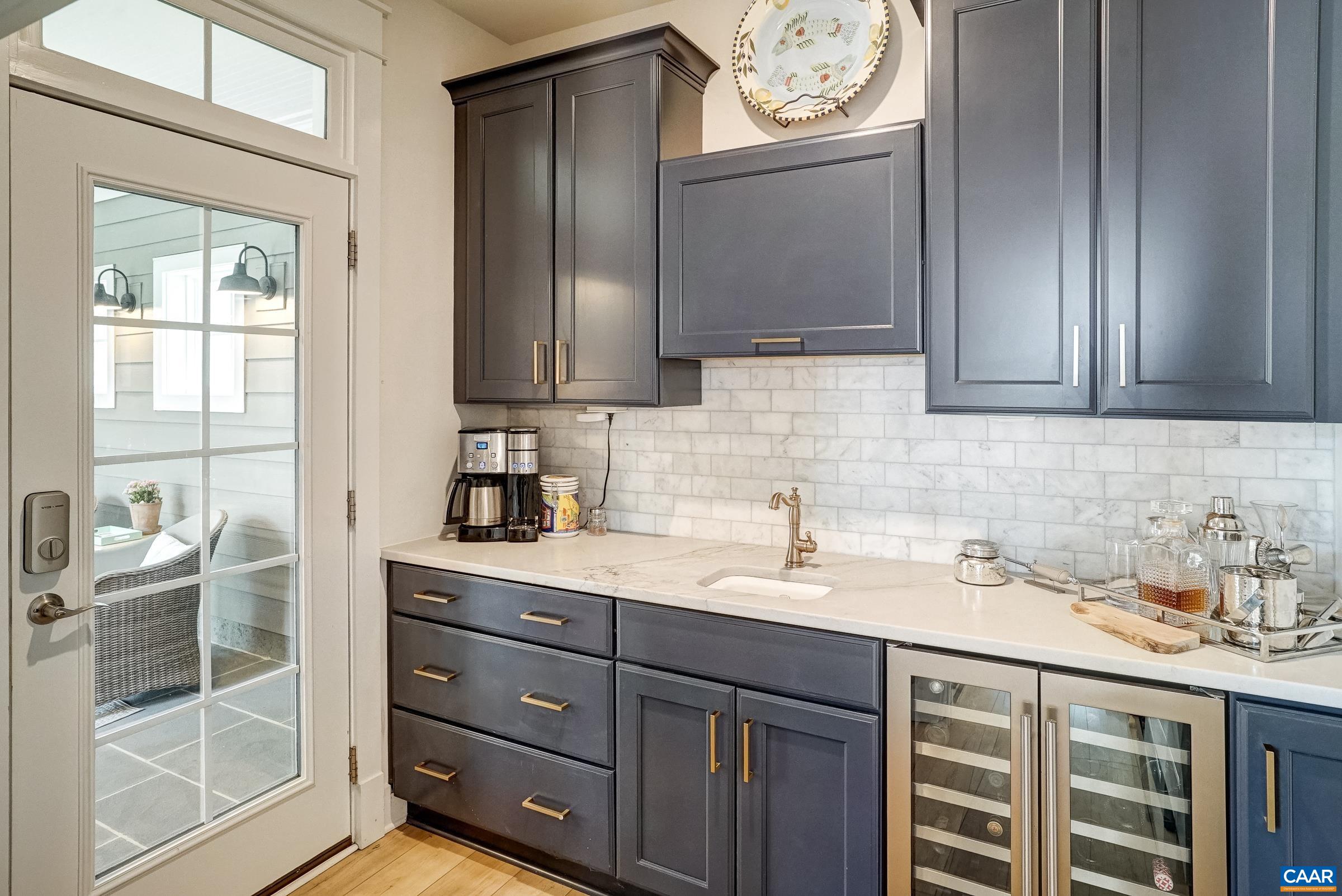 Butlers pantry with wine cooler, and bar. Butlers pantry with wine cooler, and bar.