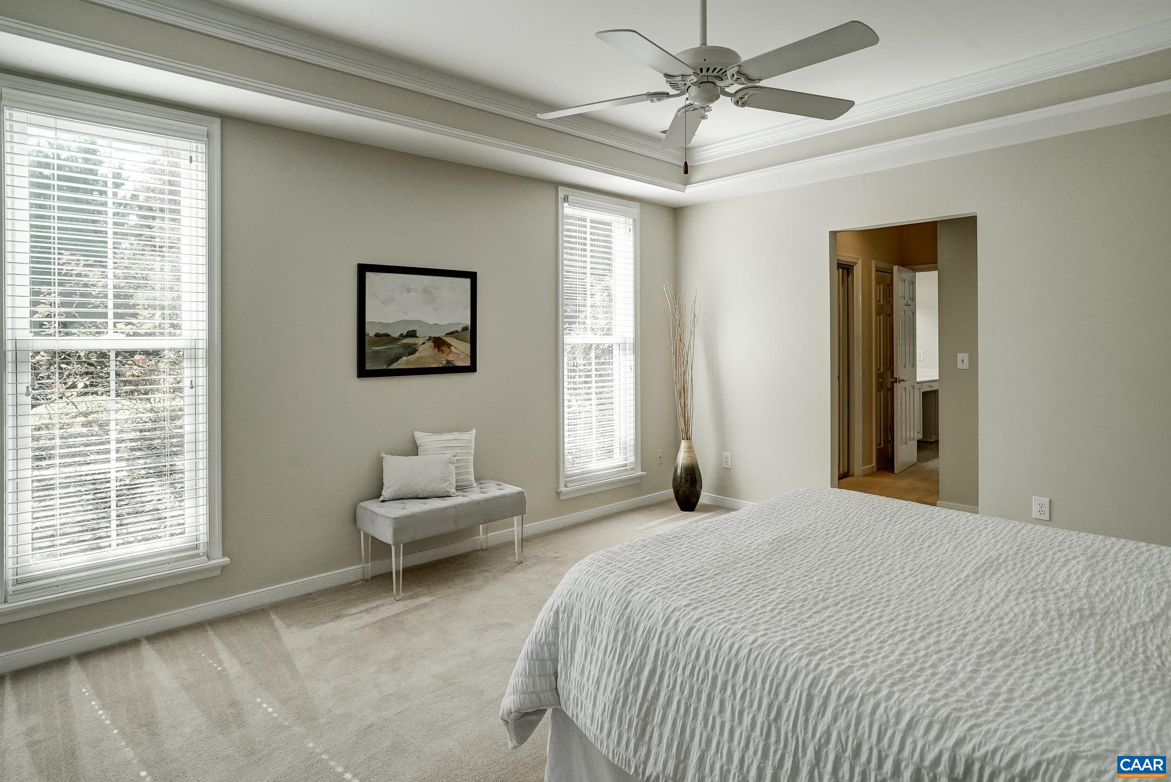Main level primary suite with multiple closets and his/hers bathrooms. Main level primary suite with multiple closets and his/hers bathrooms.