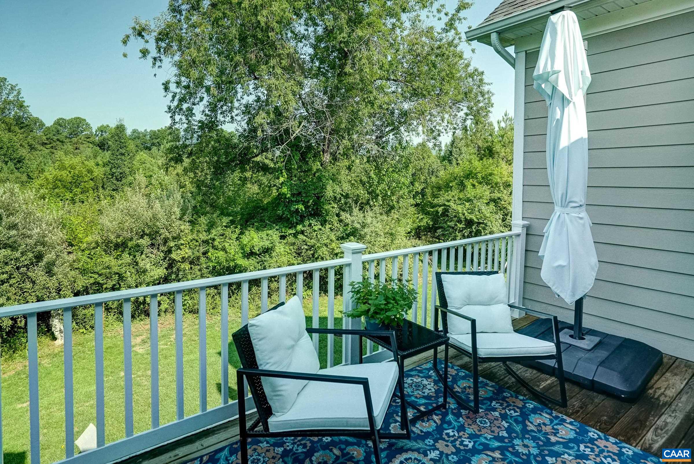 Deck overlooks wooded back yard. Deck overlooks wooded back yard.