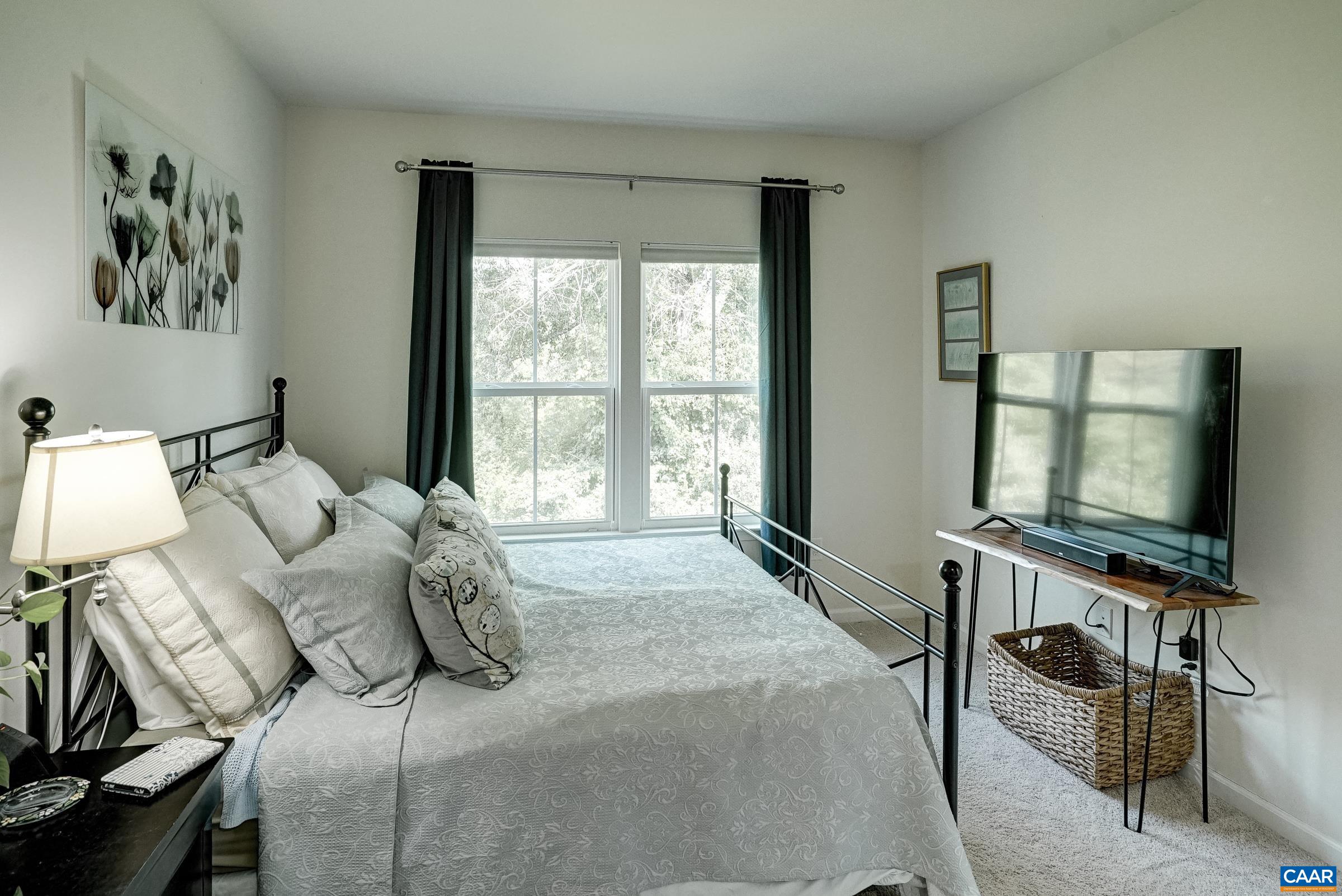 Primary suite features a quiet sitting area. Primary suite features a quiet sitting area.