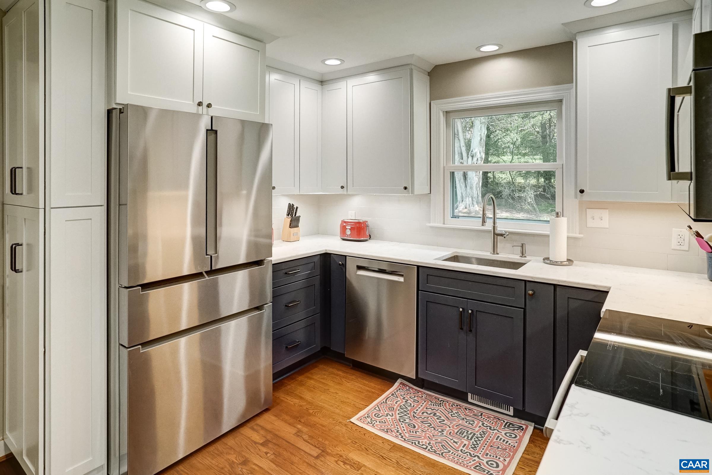 Updated kitchen features Bosch appliances, quartz countertops and tile backsplash. Updated kitchen features Bosch appliances, quartz countertops and tile backsplash.