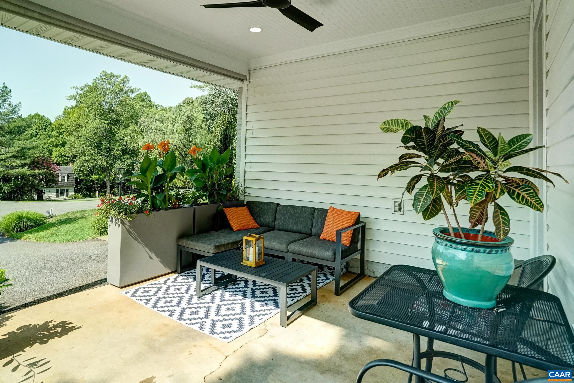 Carport sitting area features ceiling fan. Carport sitting area features ceiling fan.