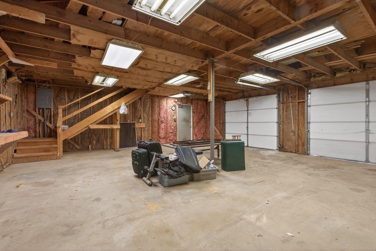 Oversized garage with steps to floored area above. Oversized garage with steps to floored area above.