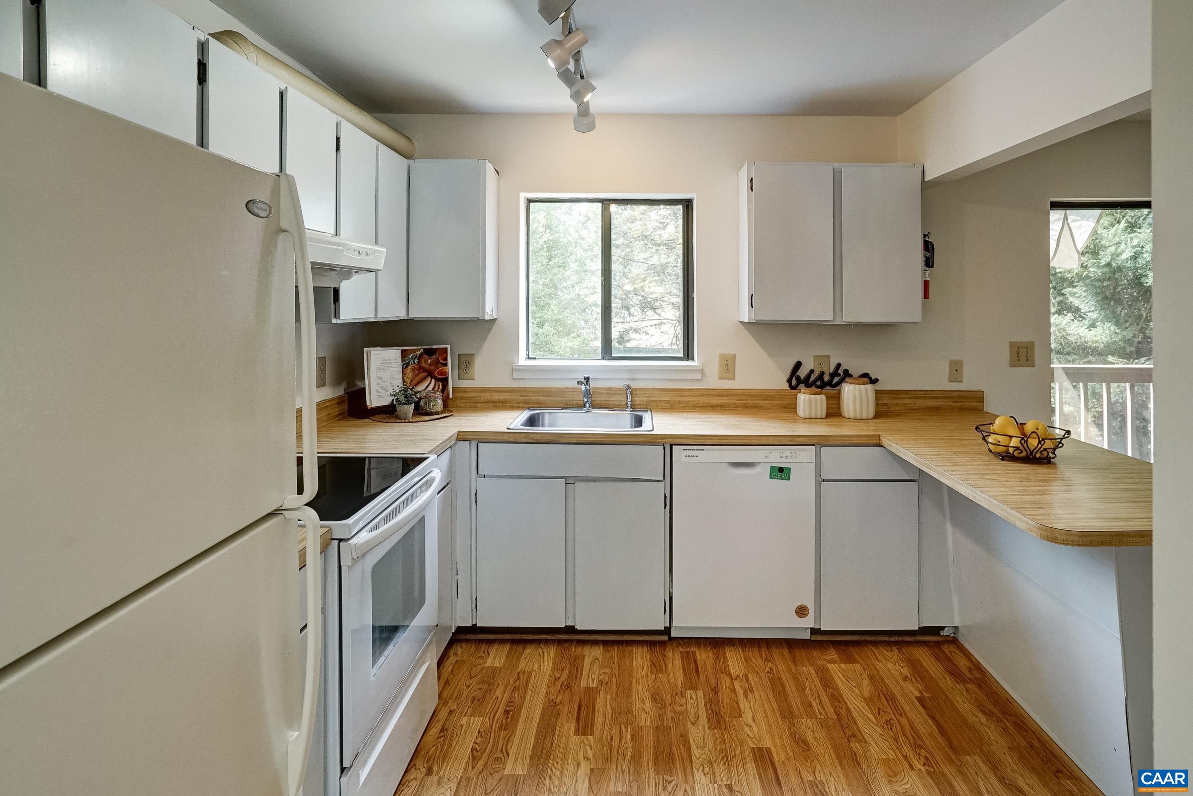 Kitchen features white appliances Kitchen features white appliances
