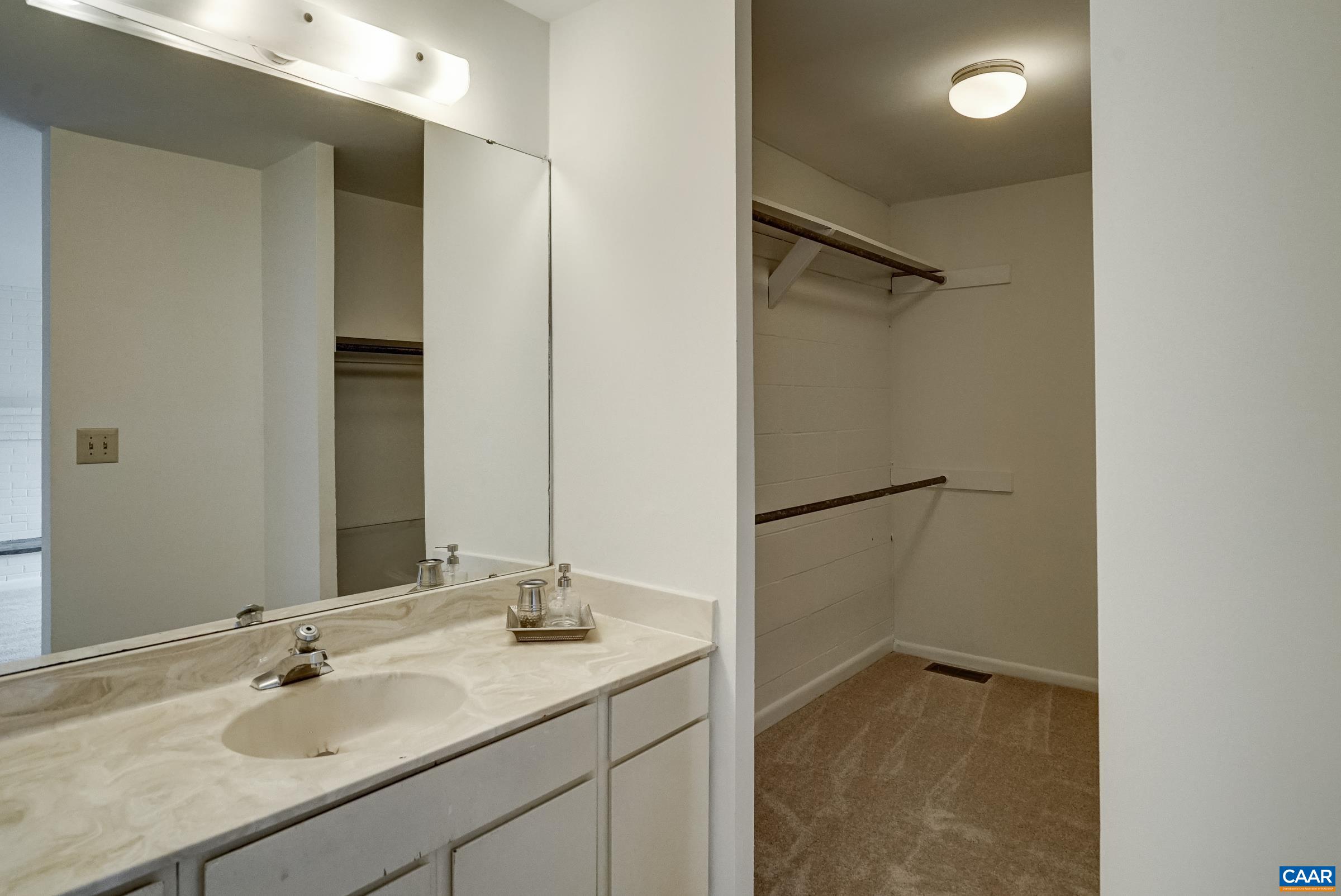 Ensuite bathroom and walk-in closet Ensuite bathroom and walk-in closet