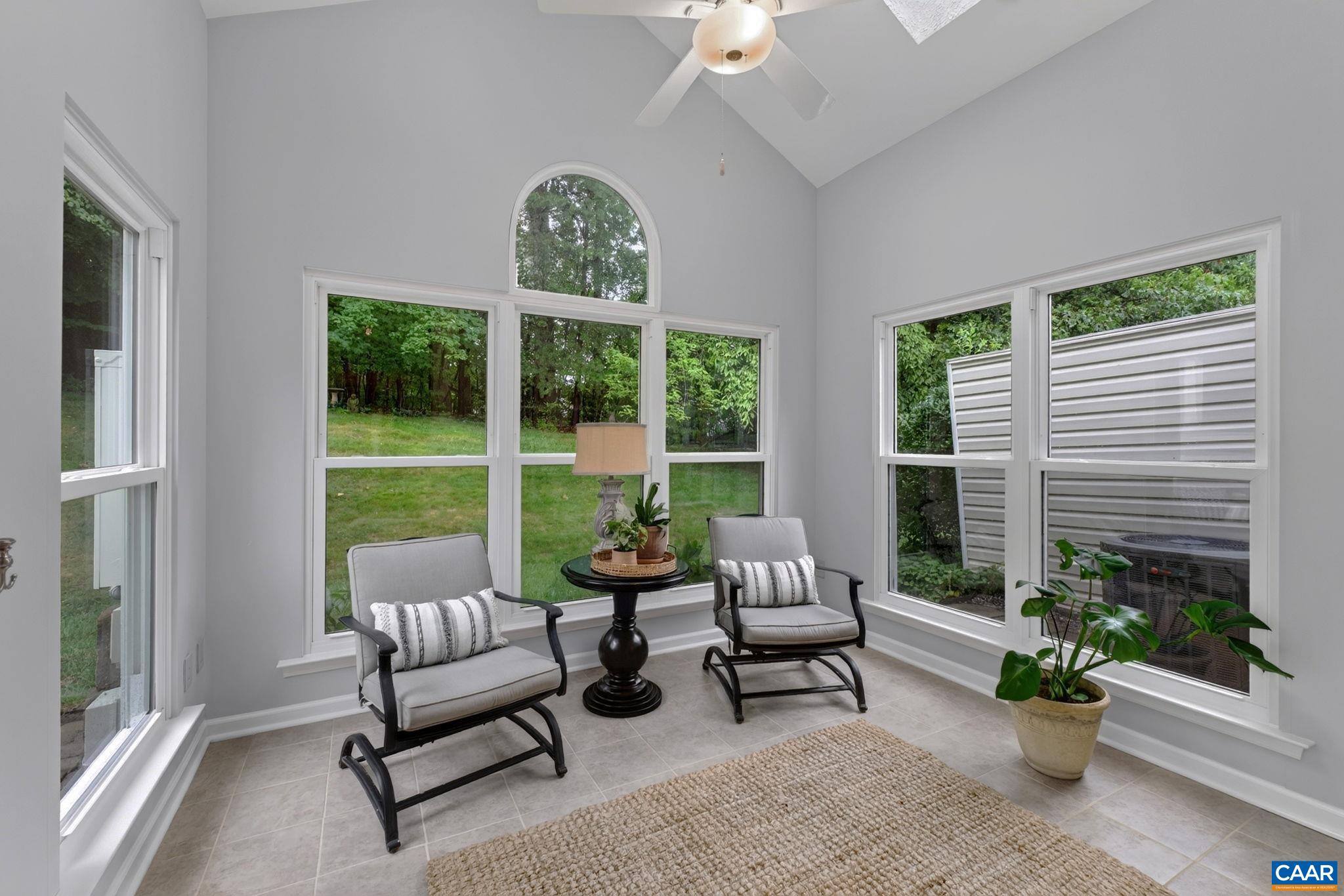 Sunroom opens out onto rear patio Sunroom opens out onto rear patio