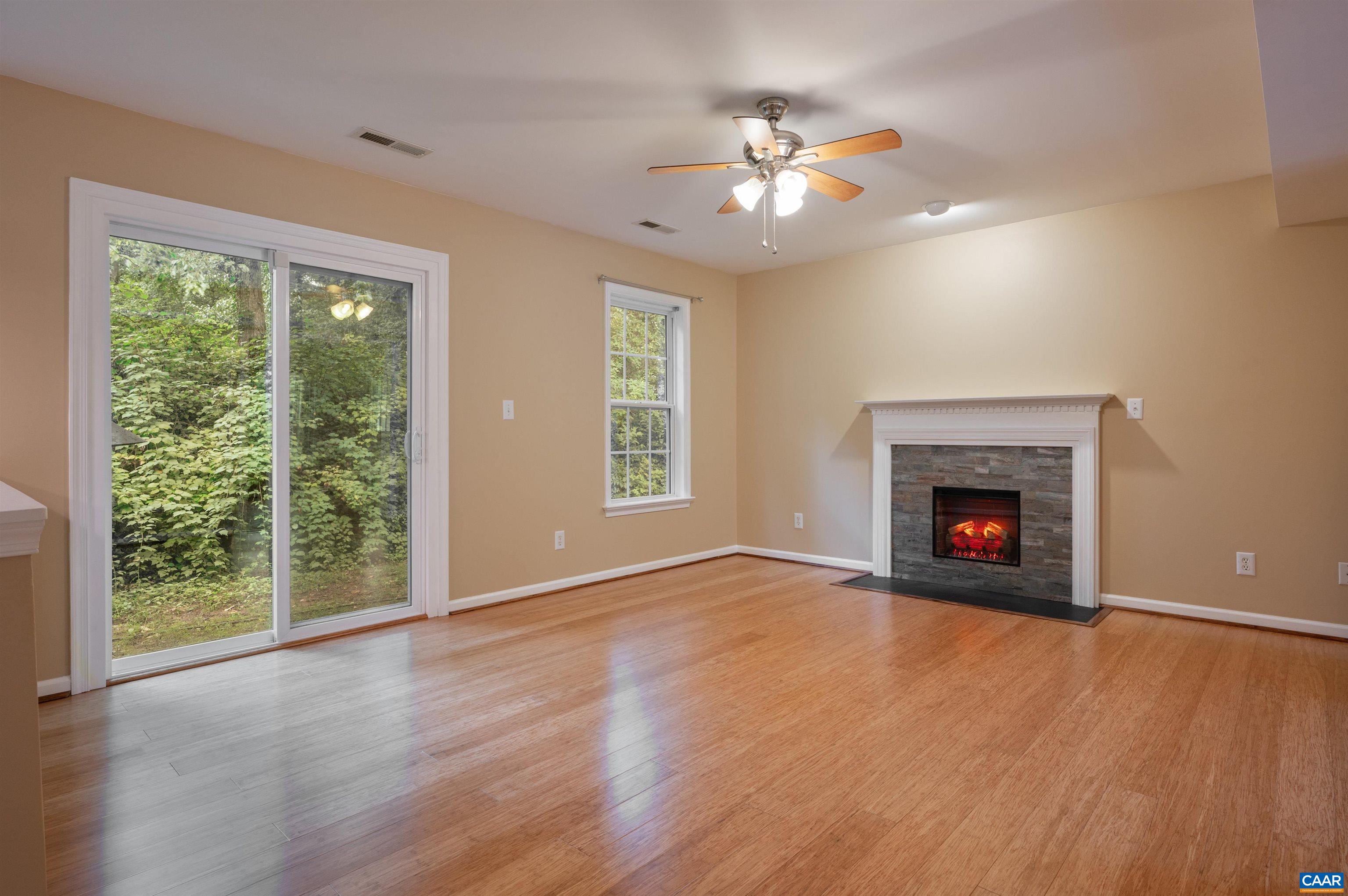 Newer bamboo flooring and fireplace with electric insert.  New sliding door to exterior.