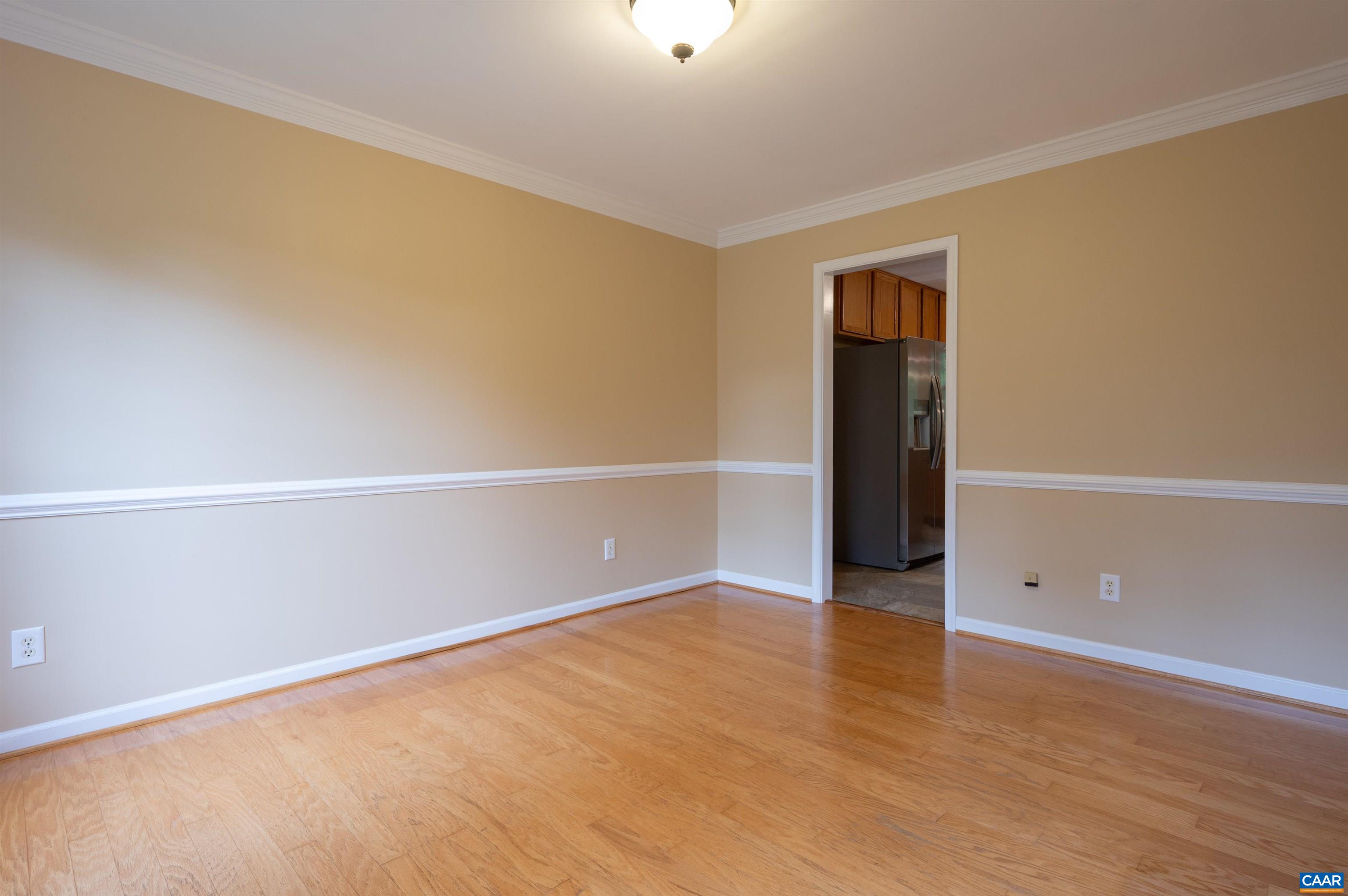 To the left of the foyer you will find the dining room, which also opens directly to the kitchen and side door.
