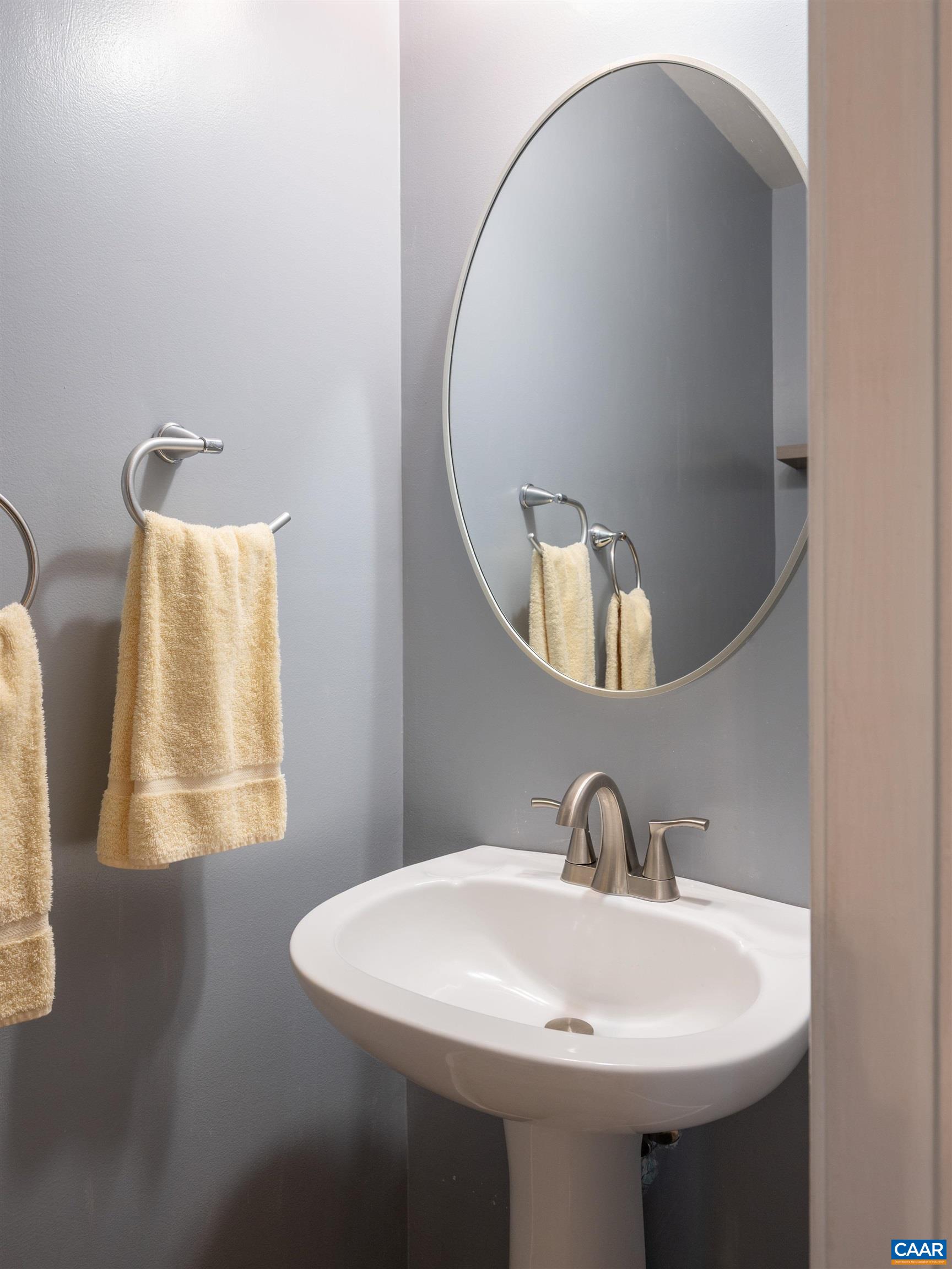 Located in the hall, off the Foyer, is a half bath for guests.
