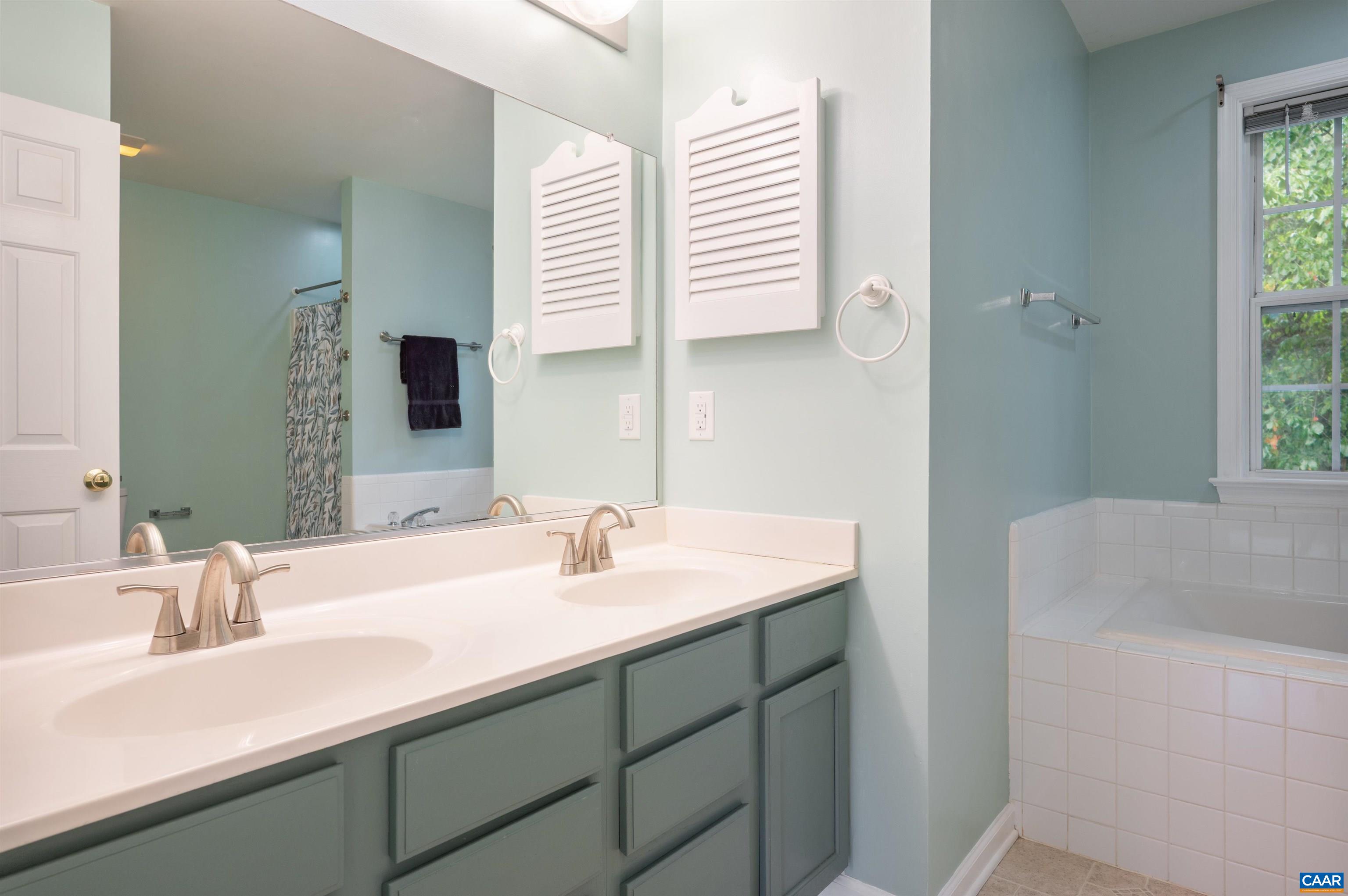 Double sink vanity, garden tub and separate shower.