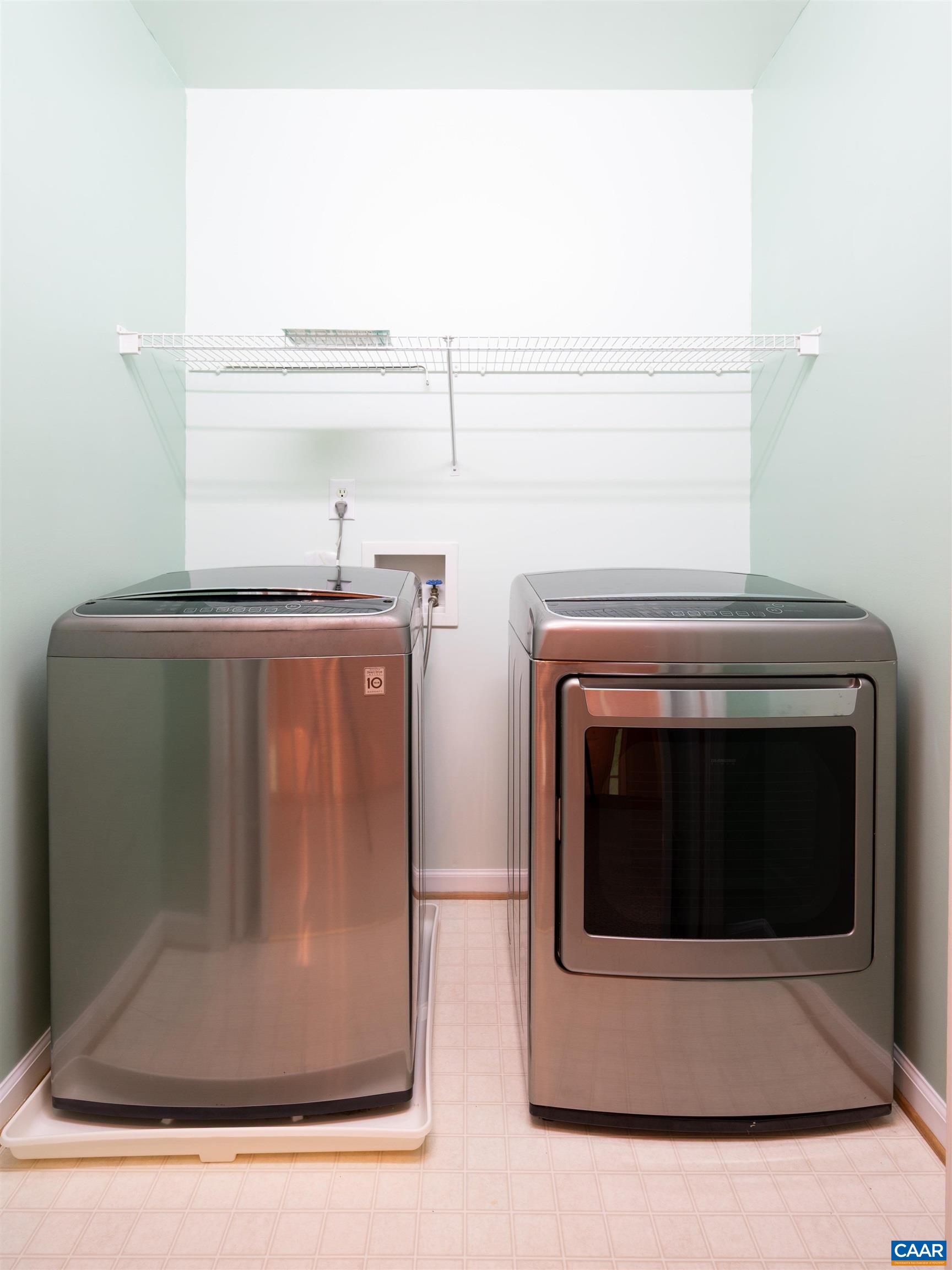 Conveniently located upstairs and adjacent to the hall bath, you'll find the laundry center.
