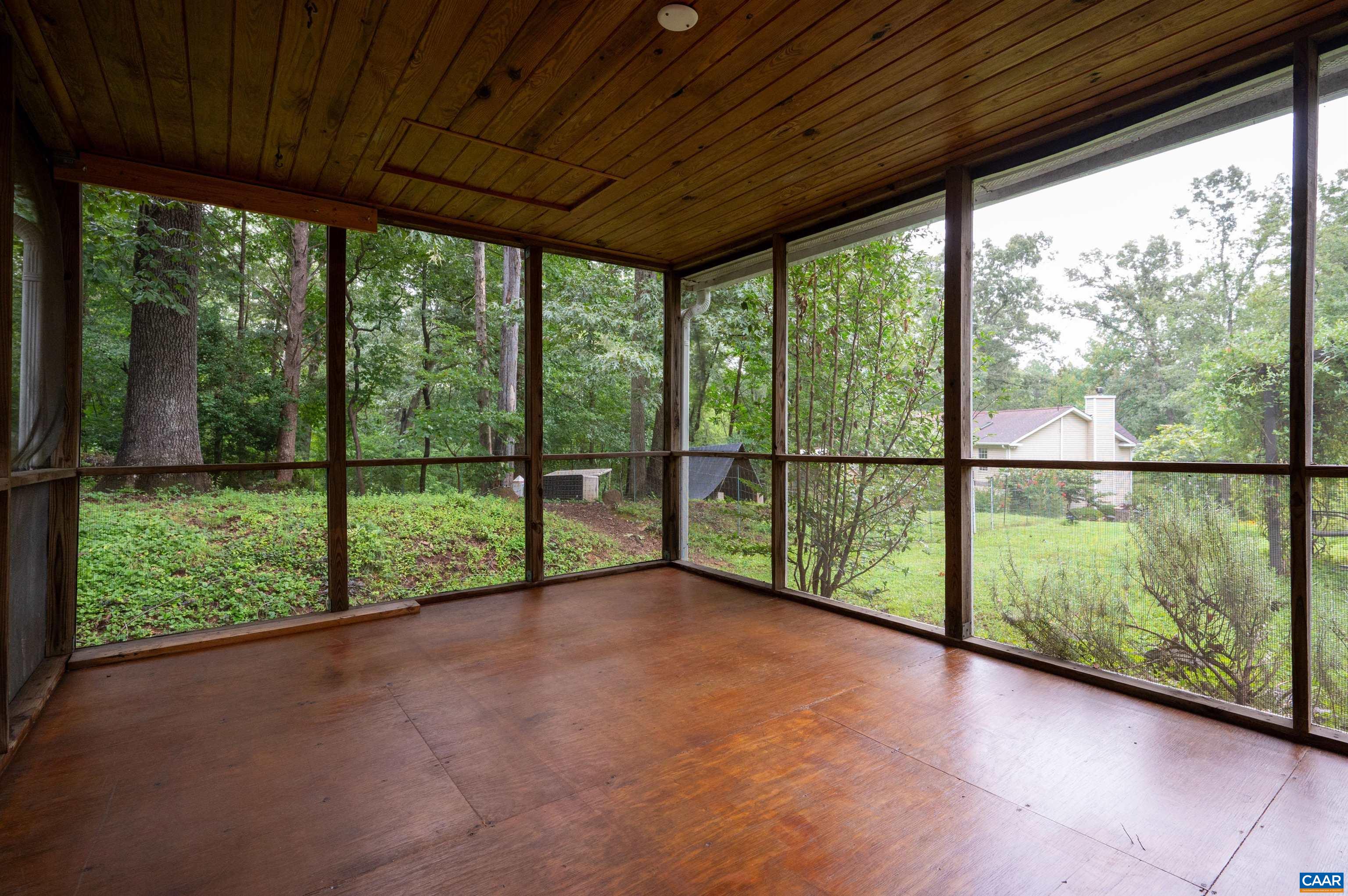 Located on the side of the house, this is a perfect spot to take in the flowering arbors, fruit trees and organic raised bed gardens.