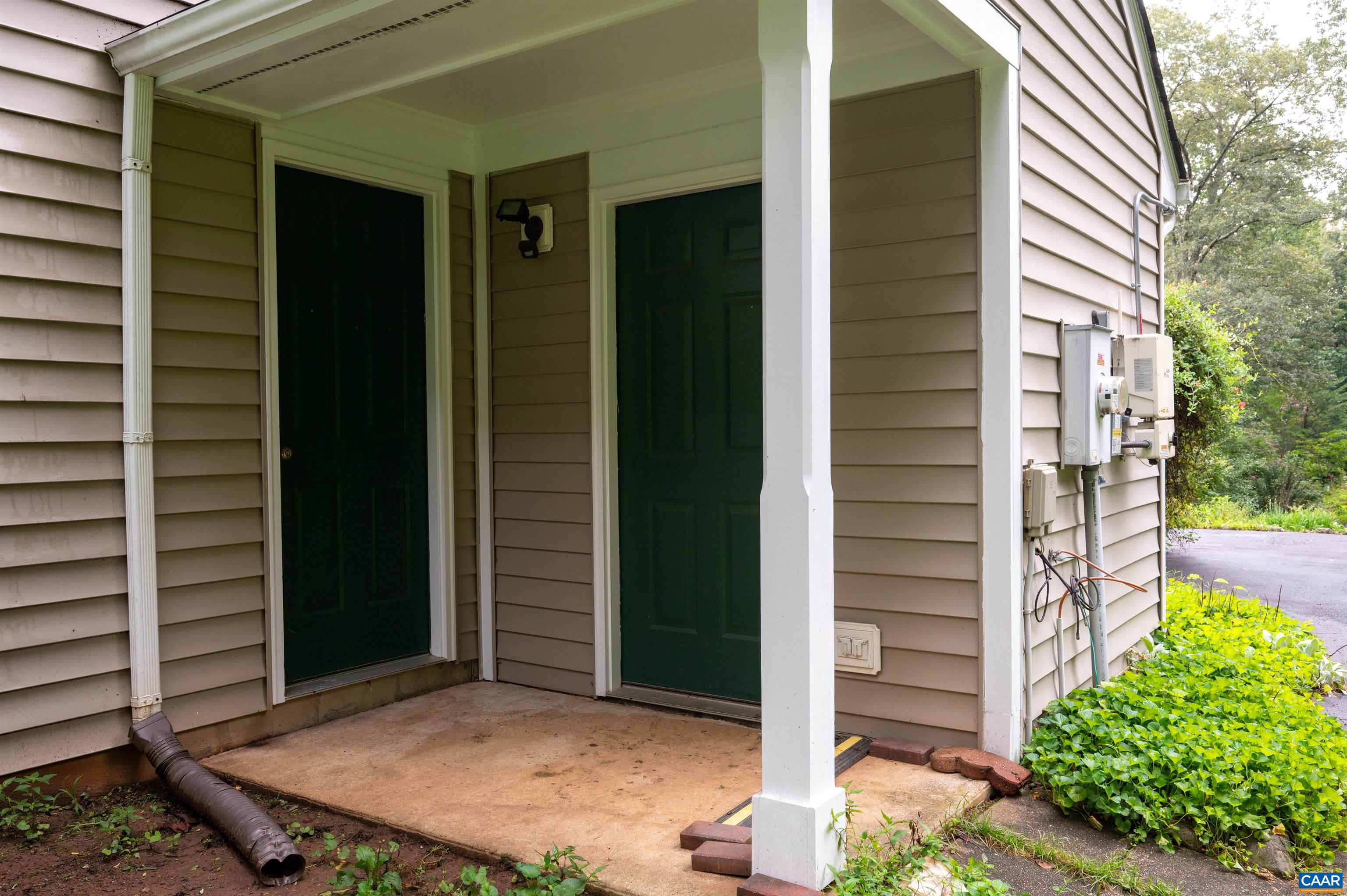 At the end of the driveway, the storage area holds garden tools and sports equipment.  While the side entry brings you easily into the kitchen.