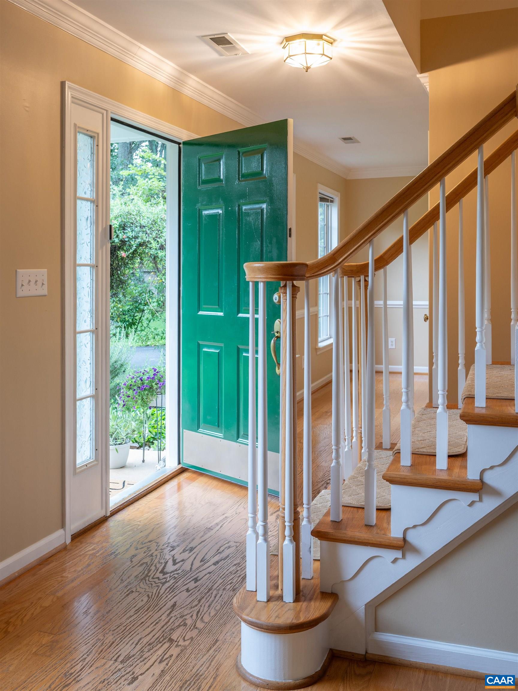 Hardwood flooring in foyer, living and dining rooms.