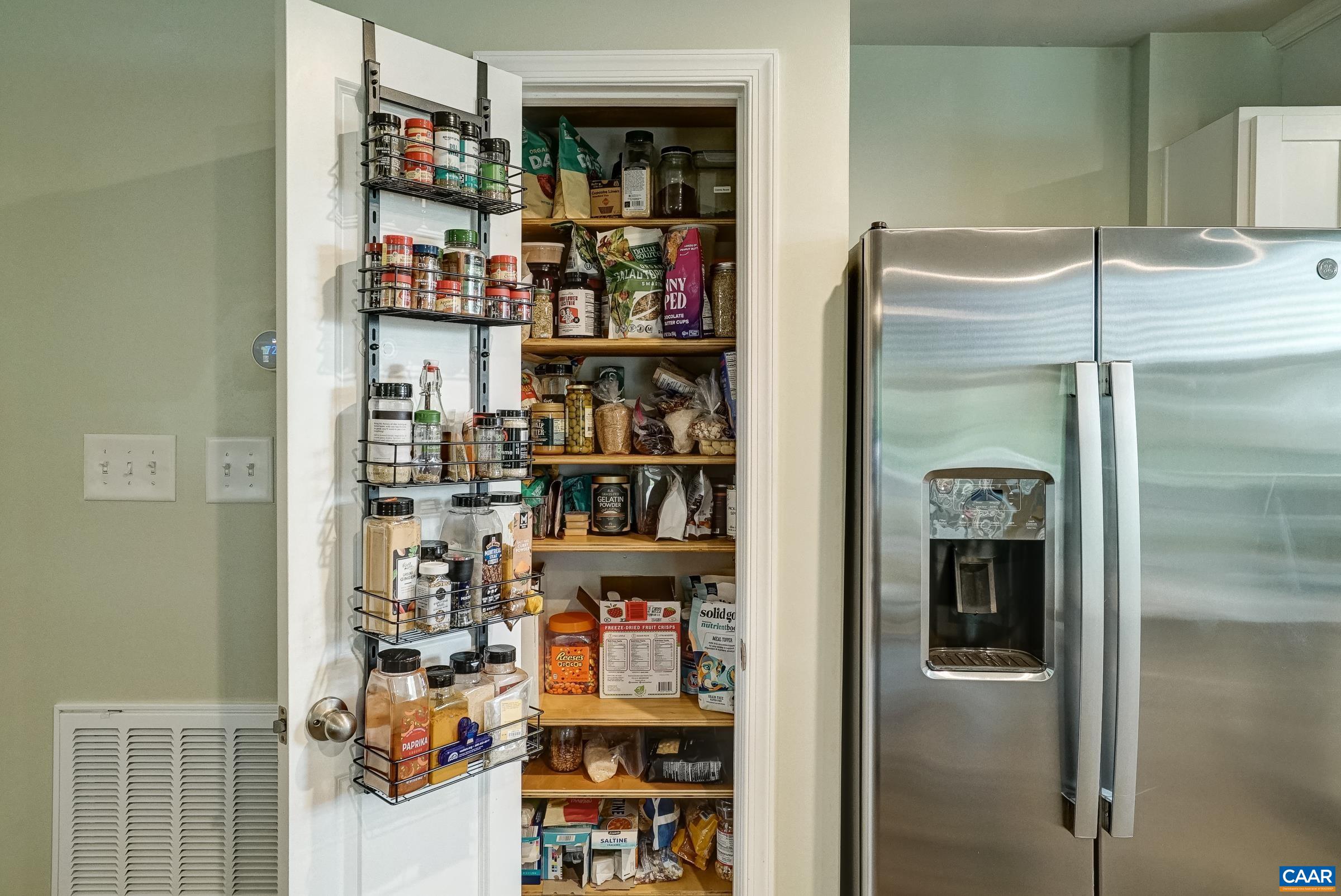 One of two custom pantries with solid adjustable shelving One of two custom pantries with solid adjustable shelving