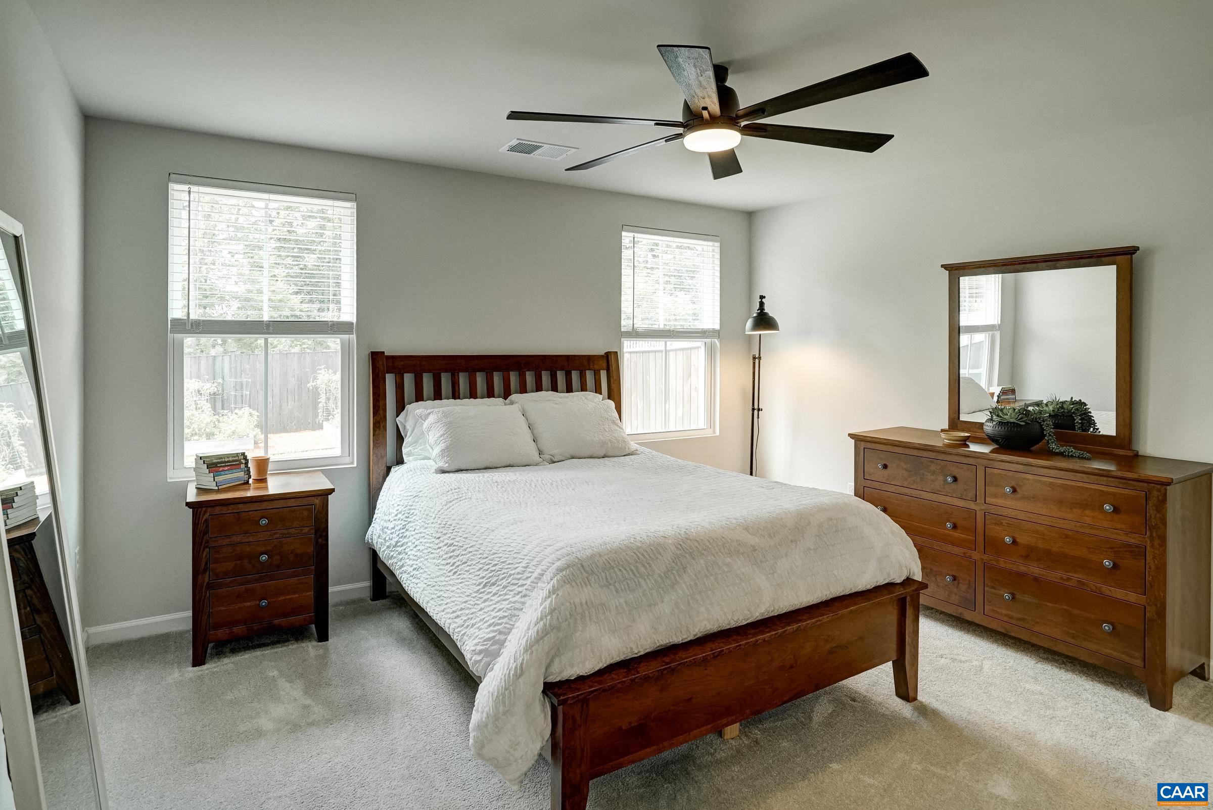 Primary suite features like-new carpet and remote controlled ceiling fan. Primary suite features like-new carpet and remote controlled ceiling fan.