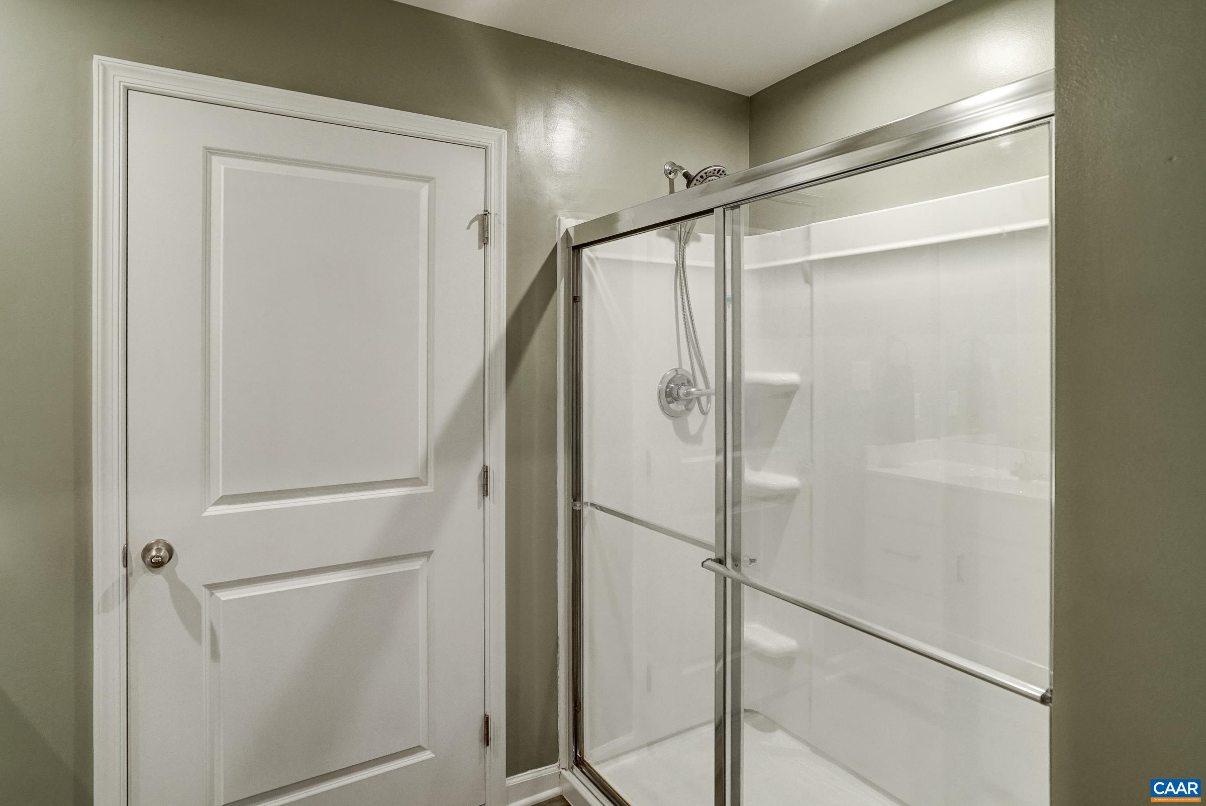 Ensuite primary bathroom with walk-in shower Ensuite primary bathroom with walk-in shower